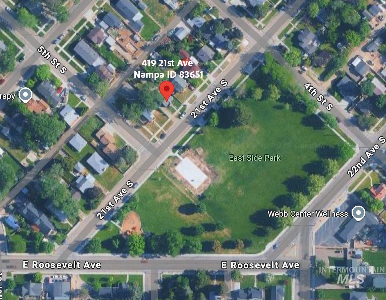 Aerial overview of property's location with property parcel outlined