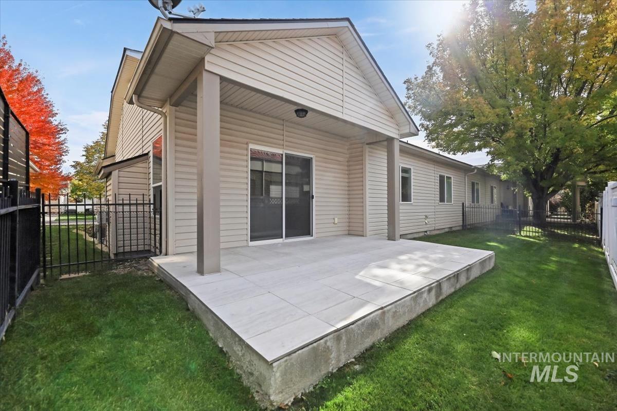 Back of house with a patio