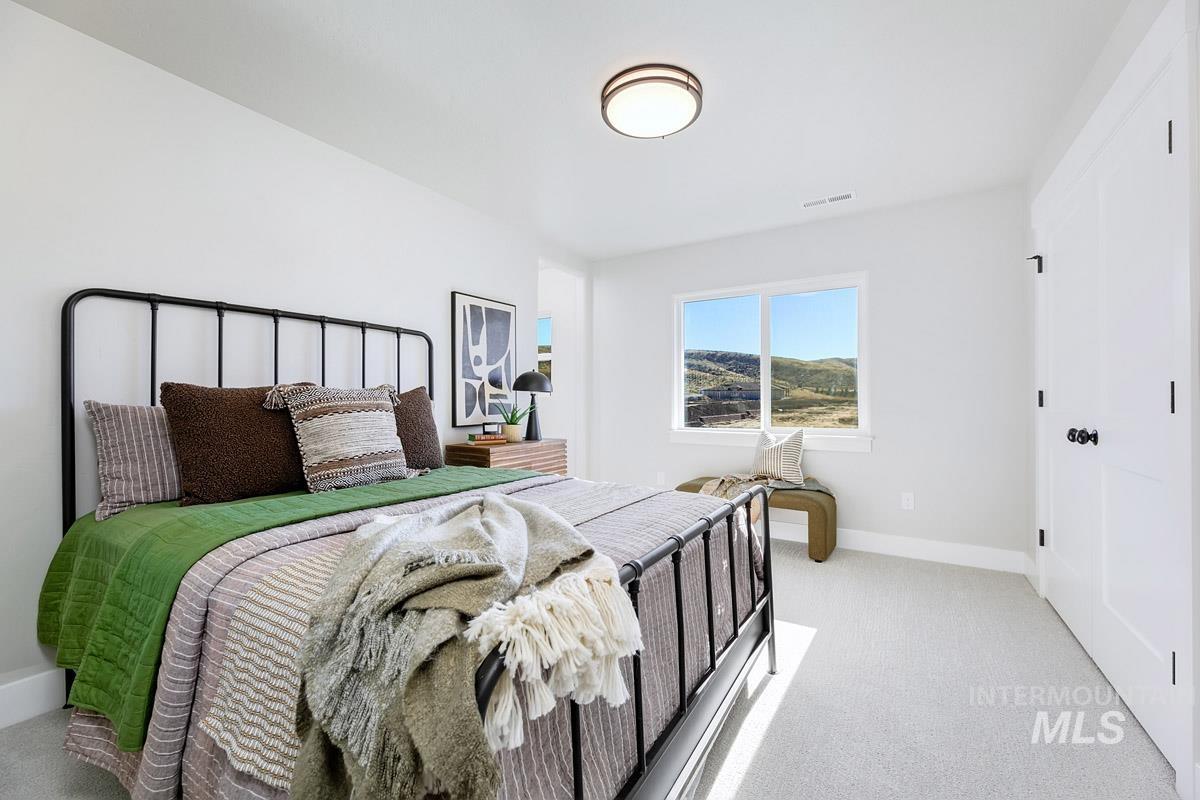 Bedroom with light carpet