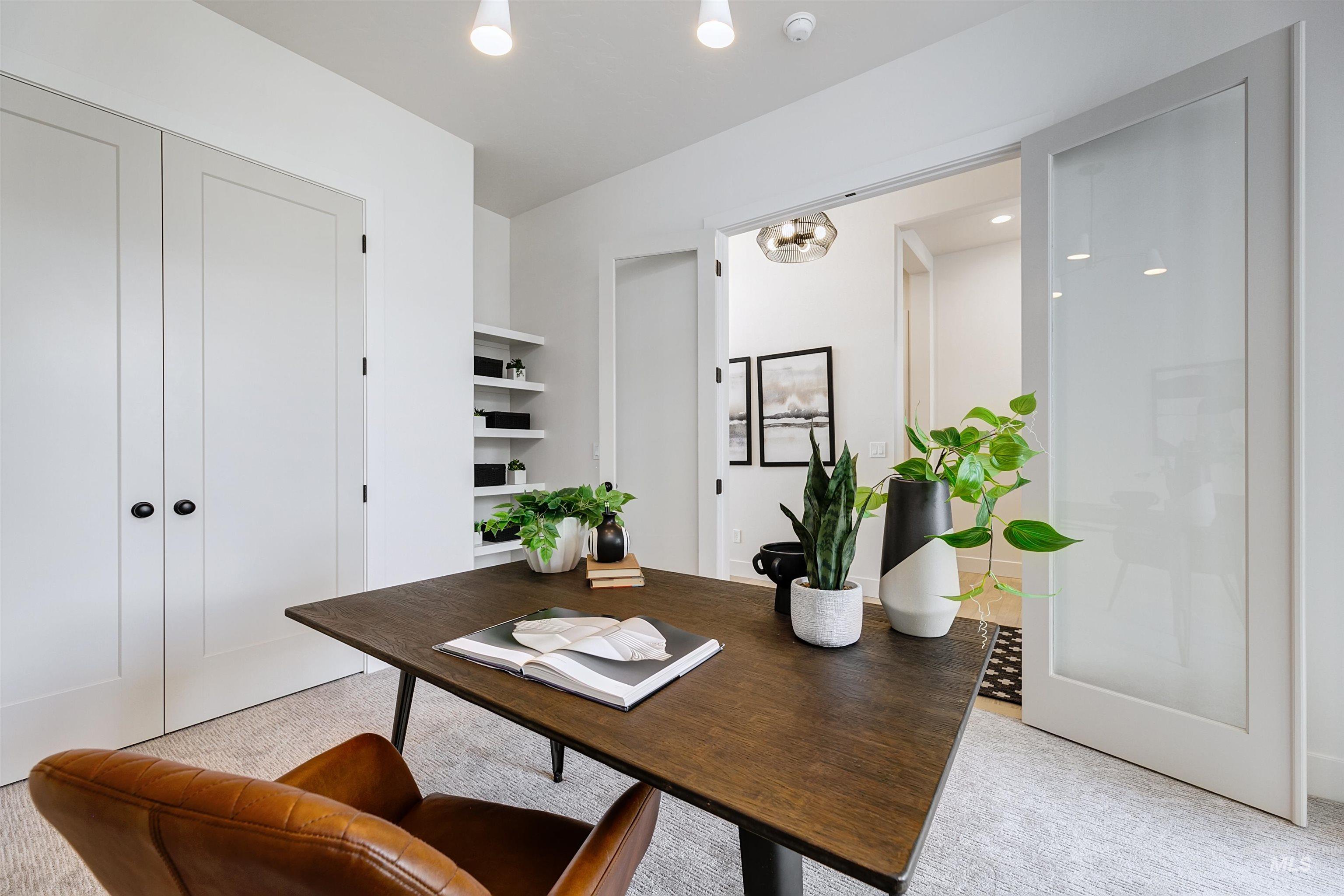 Office area featuring light colored carpet