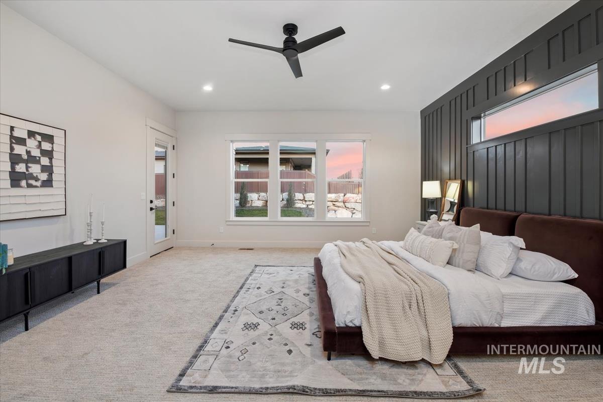 Carpeted bedroom with multiple windows, access to outside, ceiling fan, and recessed lighting