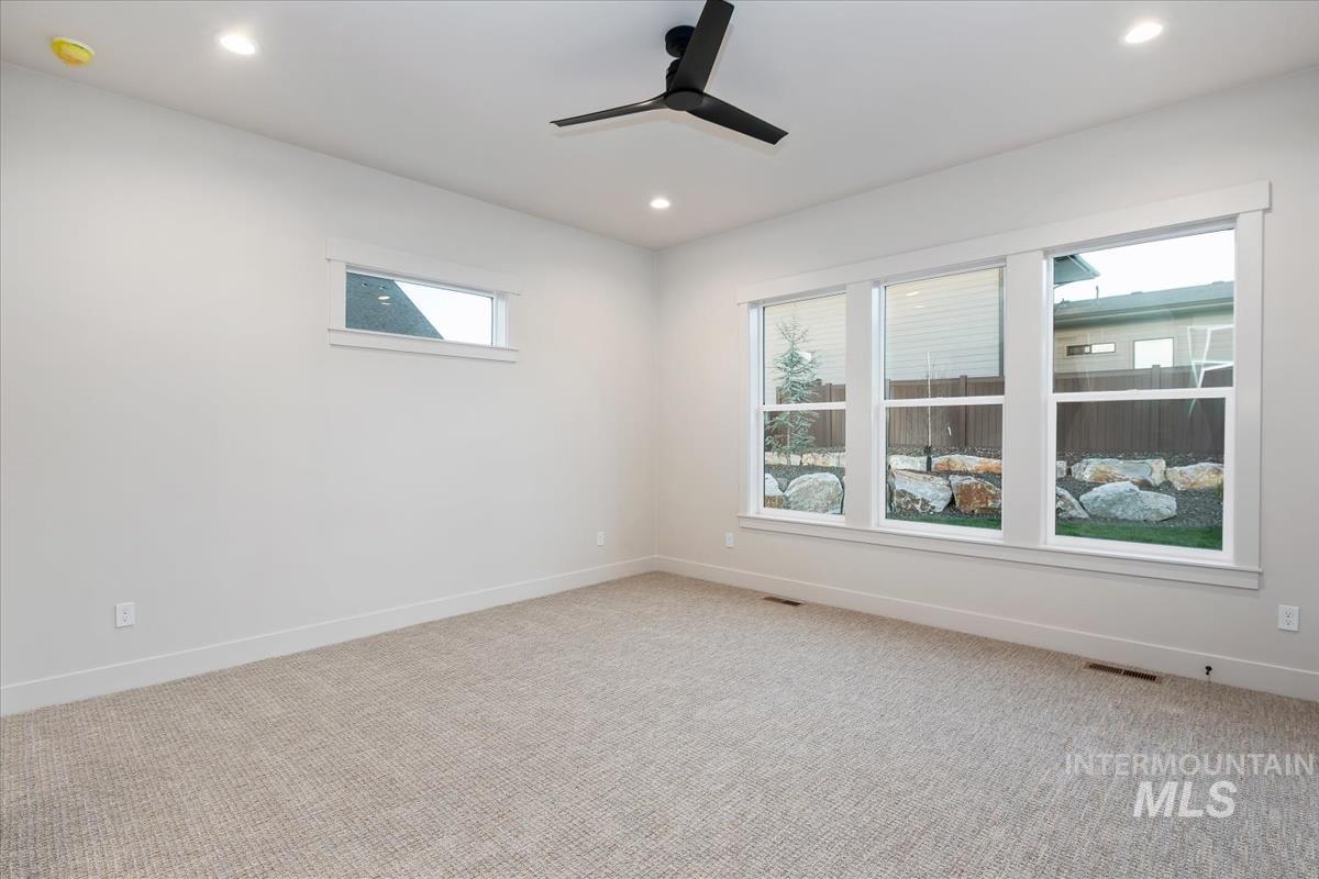 Unfurnished room with carpet, recessed lighting, and a ceiling fan
