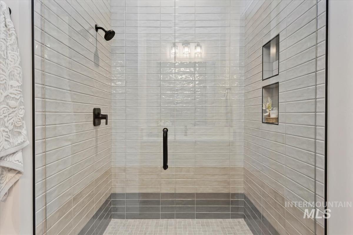 Bathroom featuring a shower stall