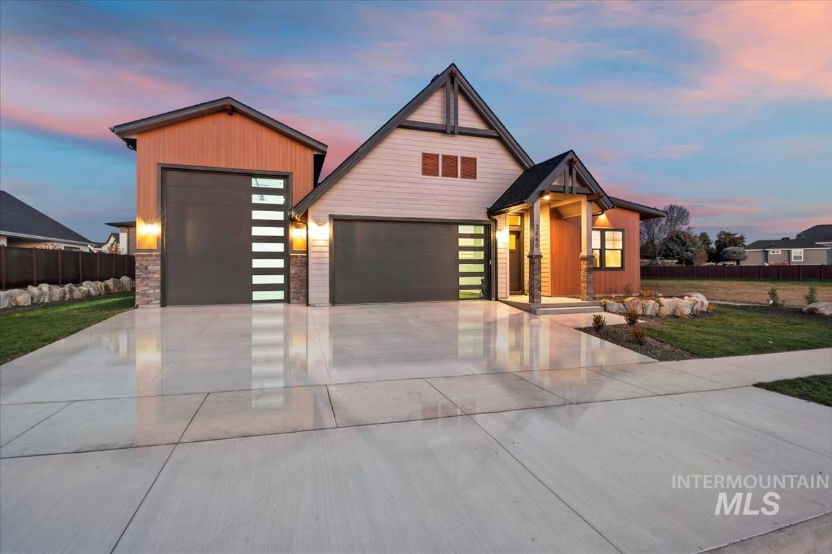 Modern home with an attached garage and concrete driveway