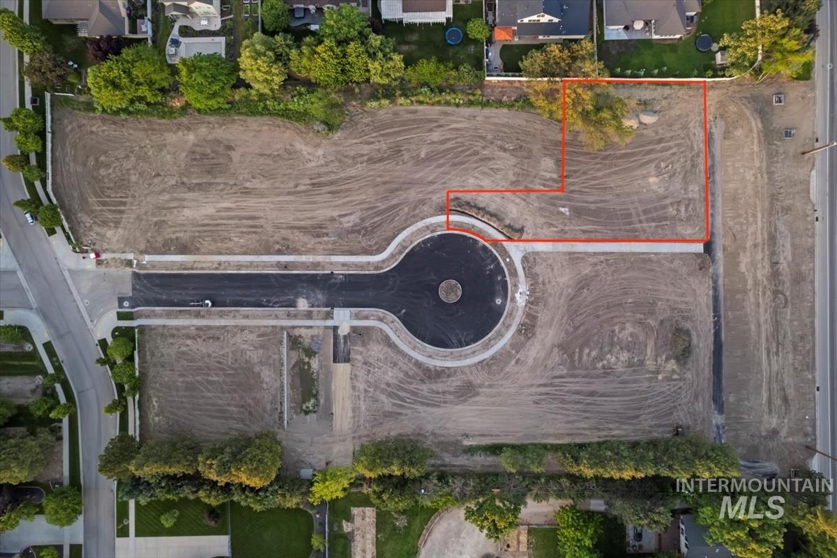 Aerial perspective of suburban area with property parcel outlined