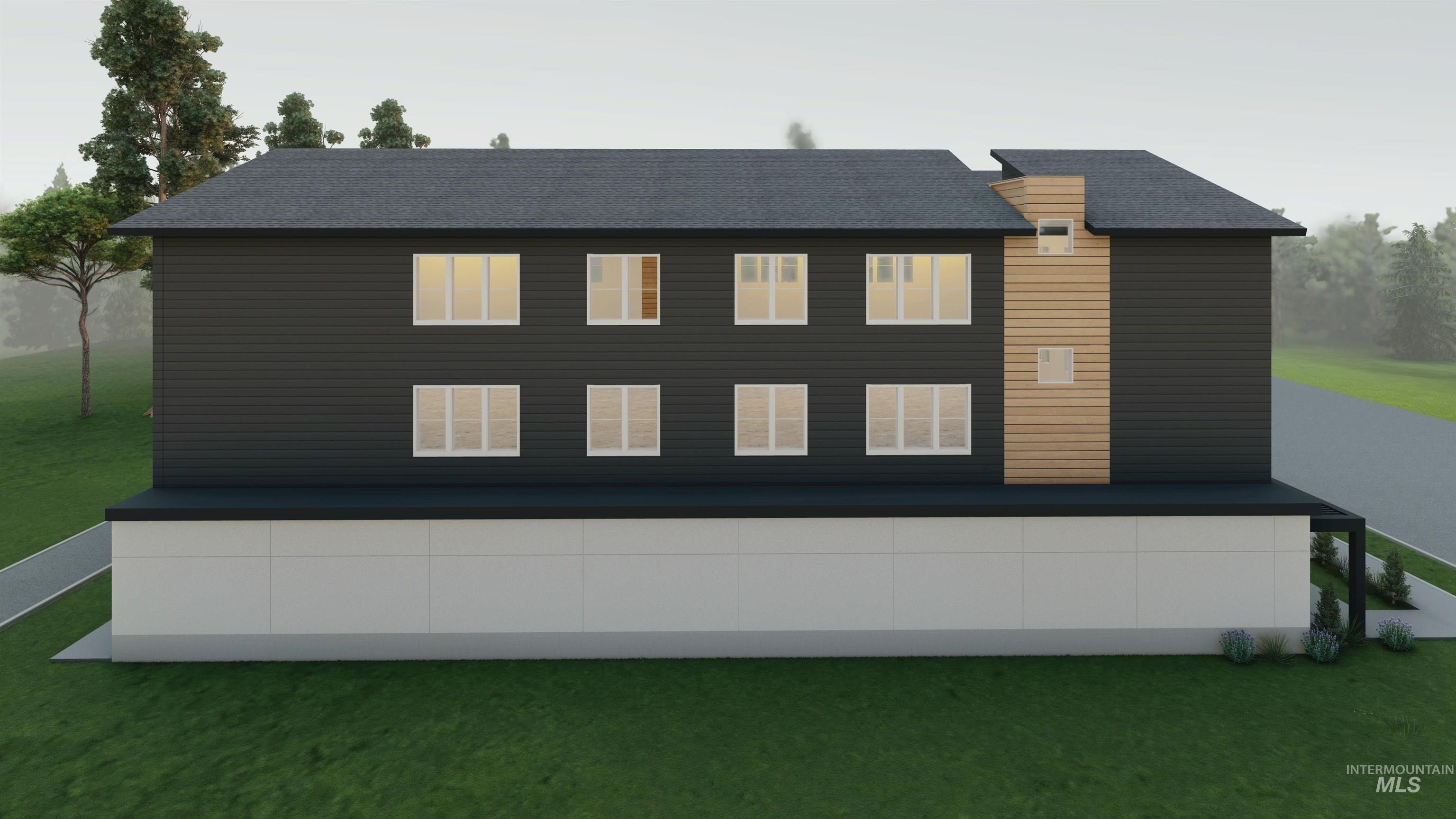 Back of property featuring a lawn and a shingled roof