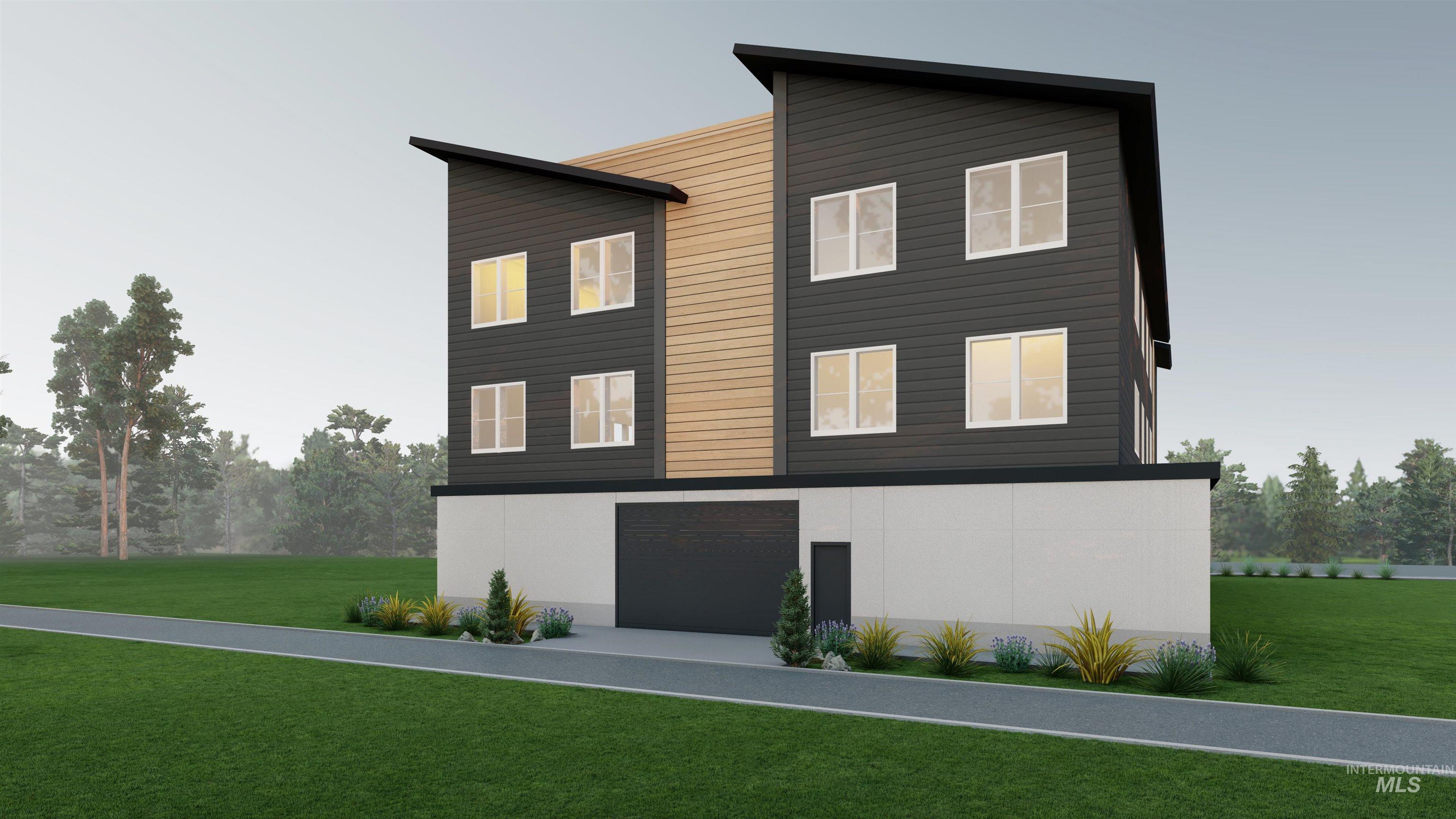 View of front of property with a front lawn and a garage