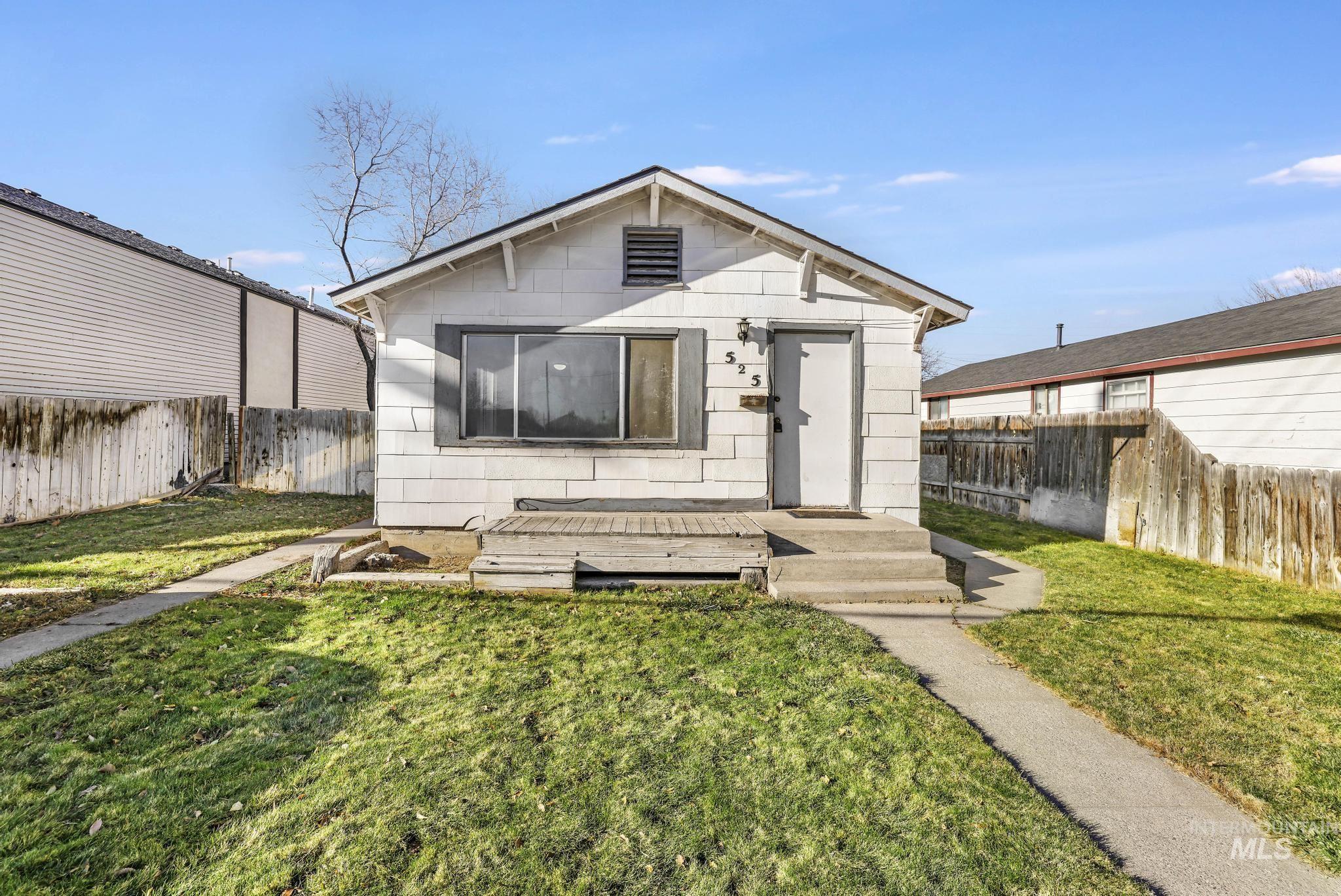 View of front of house with a fenced backyard