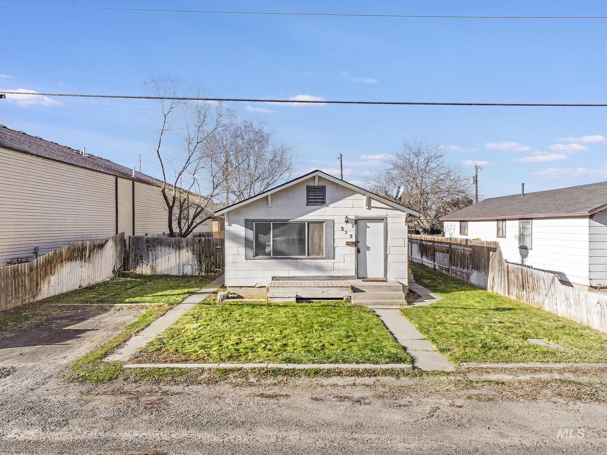 Bungalow-style house featuring a fenced backyard