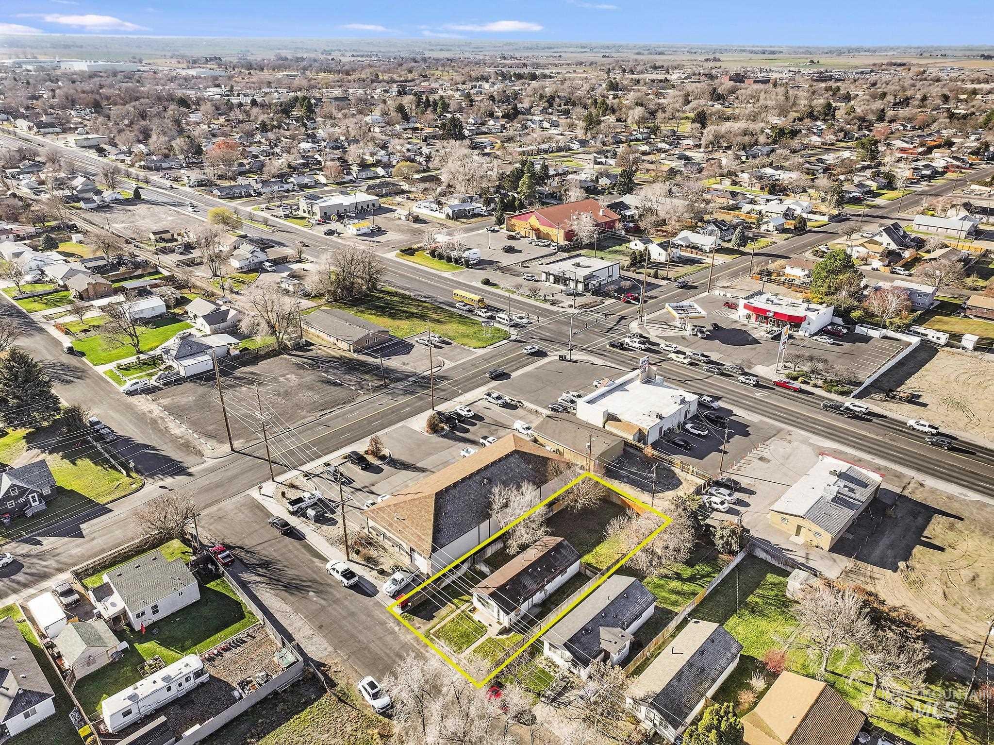 Aerial perspective of suburban area with property parcel outlined