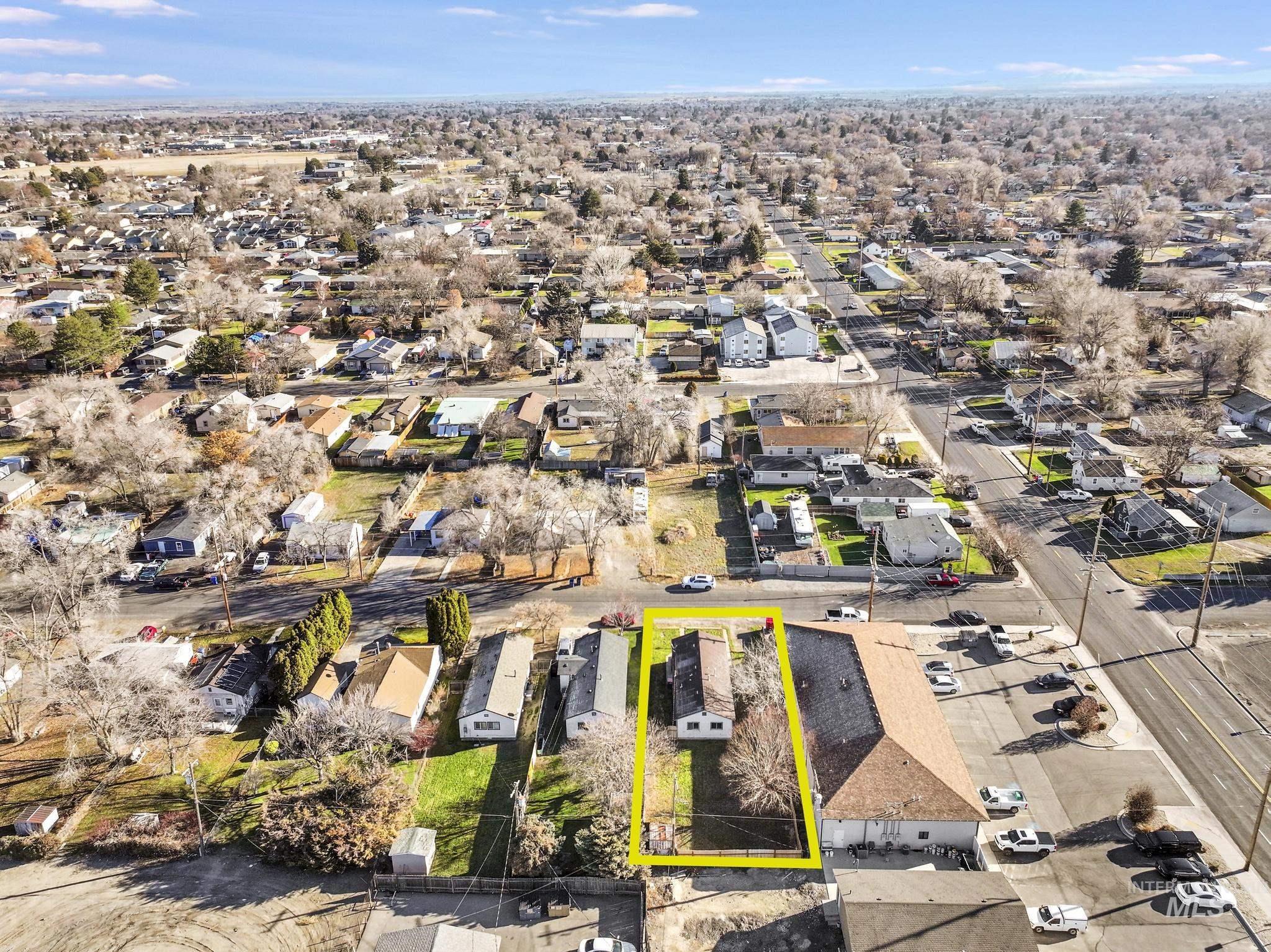 Aerial perspective of suburban area with property parcel outlined