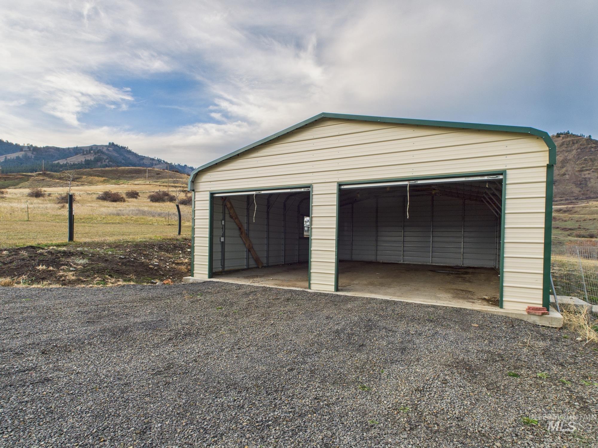 Detached garage featuring a mountain view