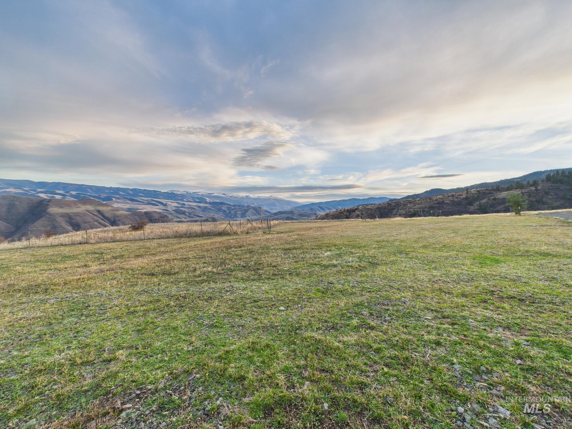View of mountain backdrop featuring rural landscape