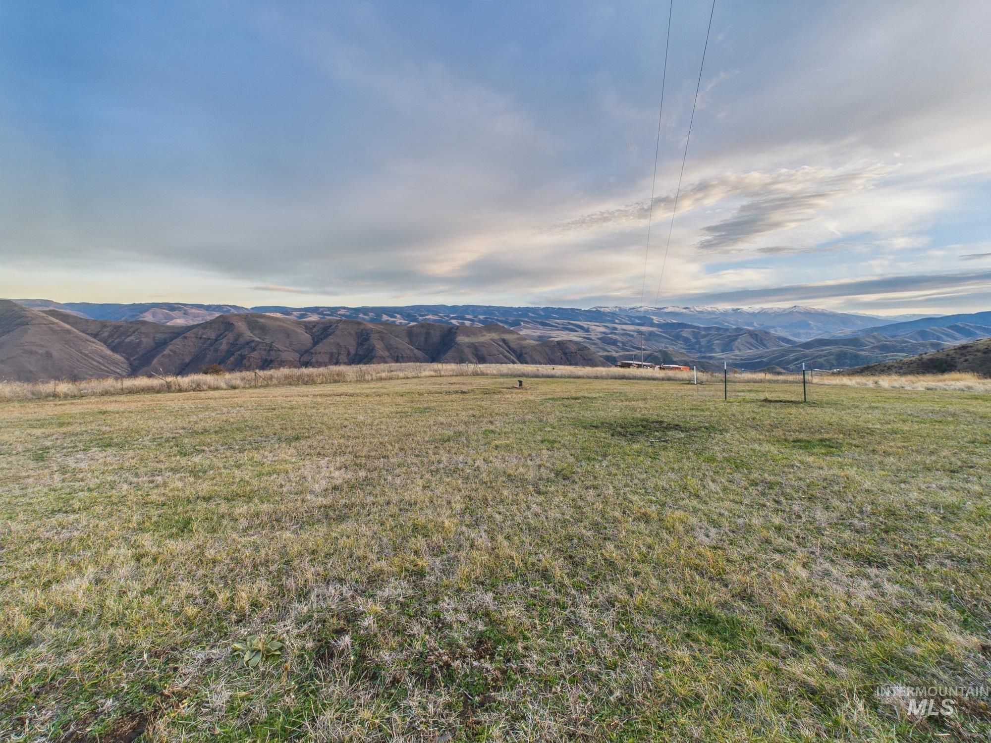 View of mountain backdrop featuring rural landscape