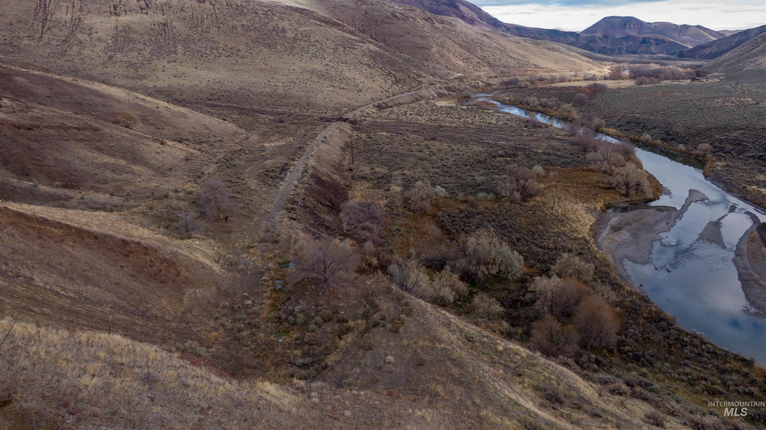 View of mountain backdrop with a nearby body of water