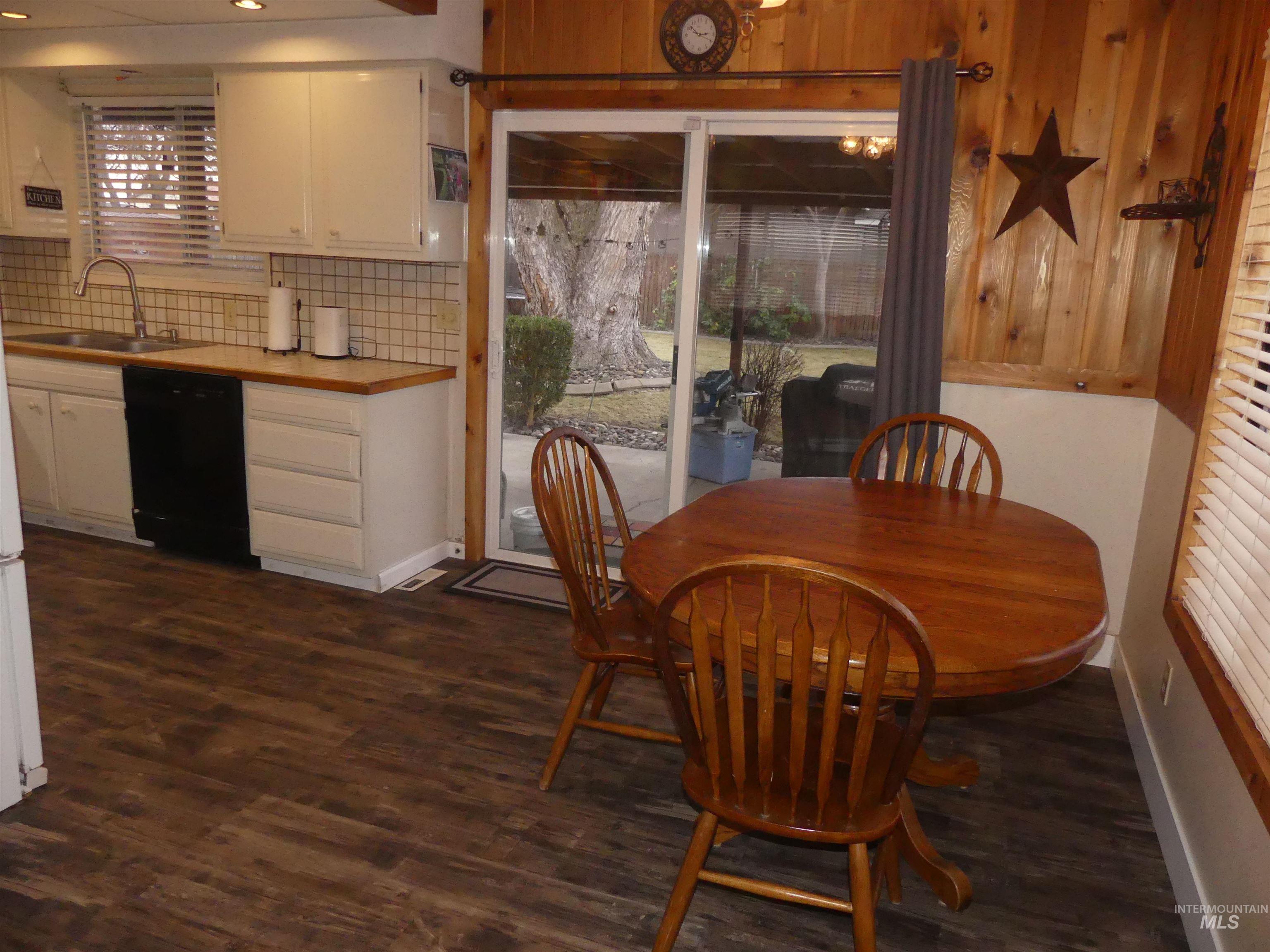 Dining area featuring dark wood finished floors