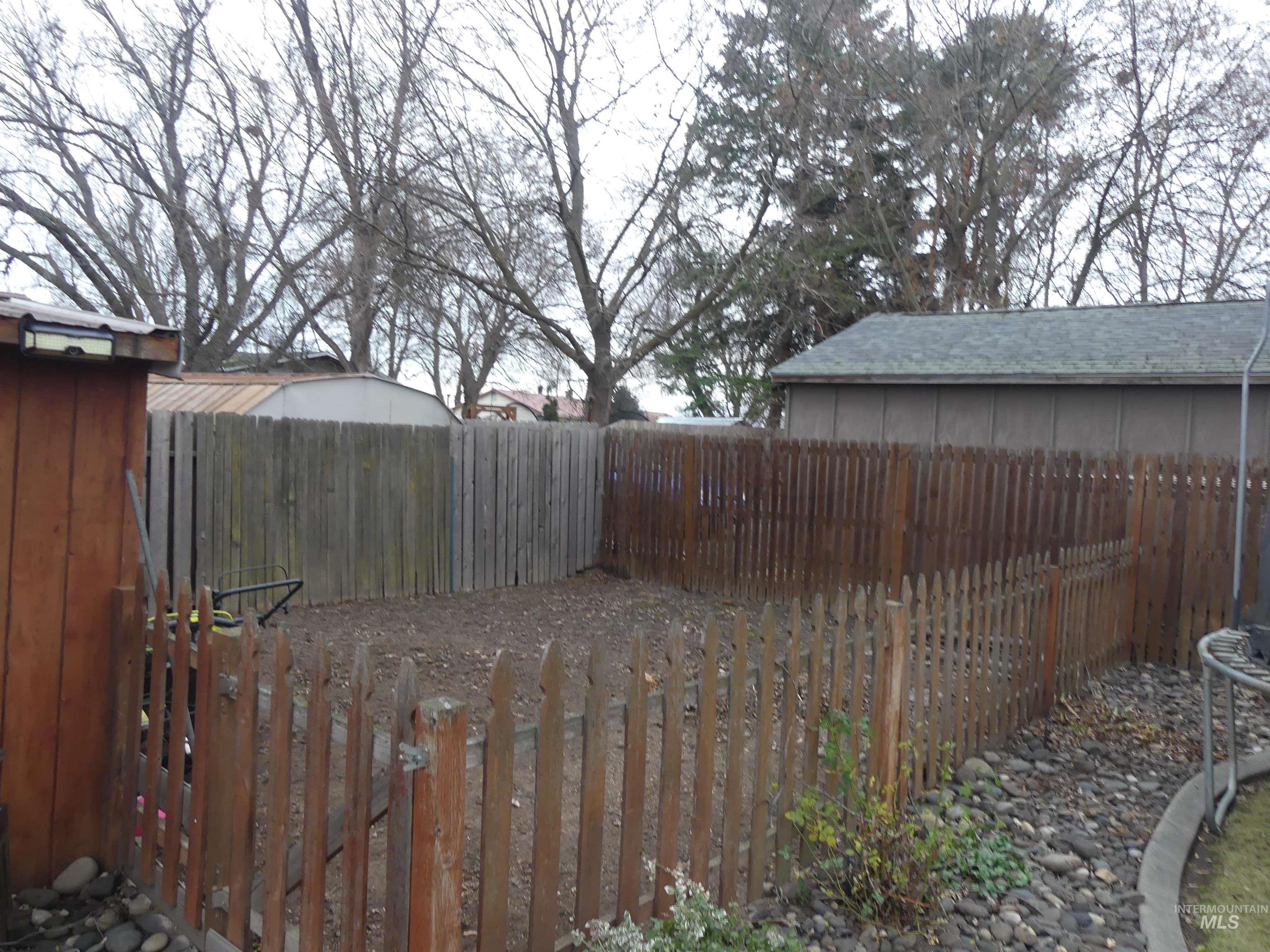 View of fenced backyard