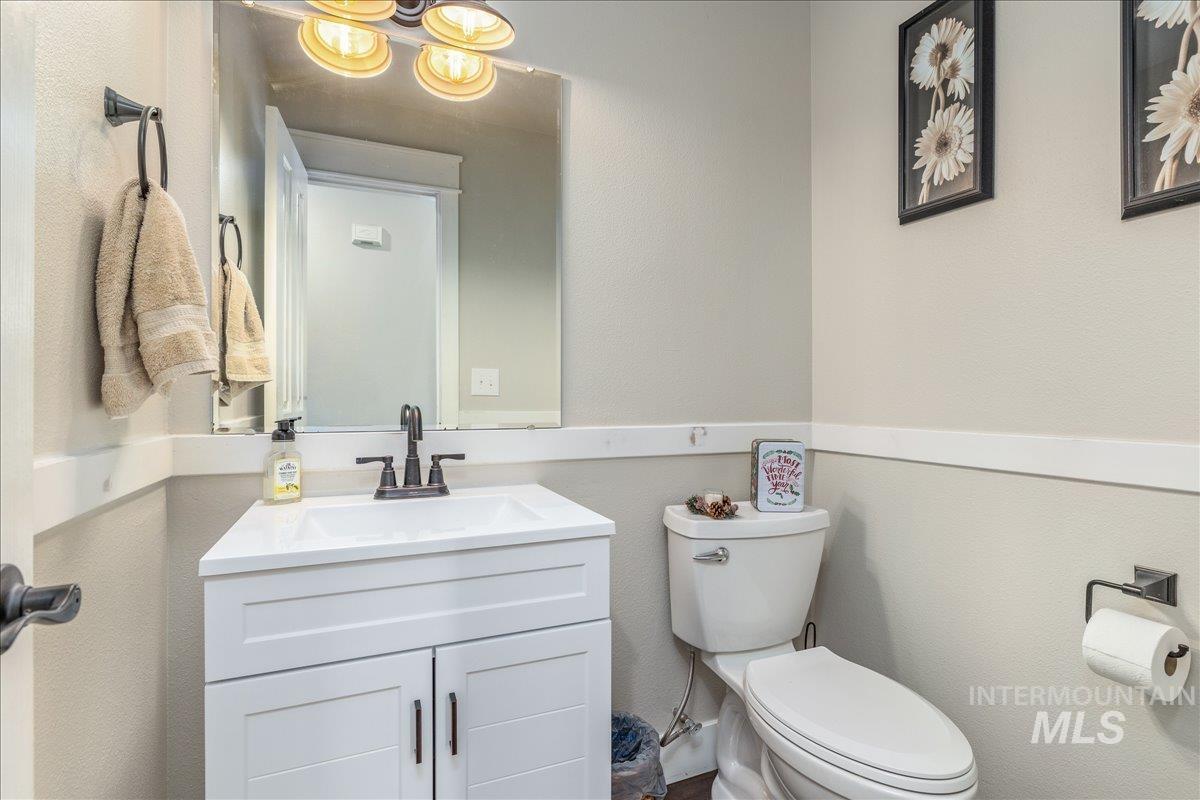 Bathroom featuring vanity and a textured wall