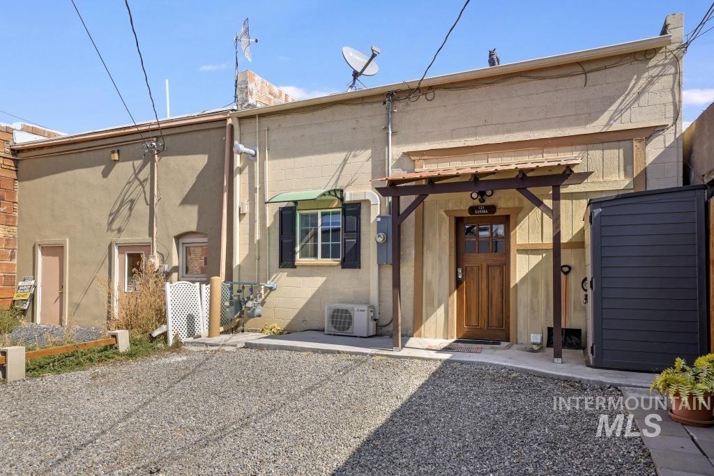 Back of property with concrete block siding