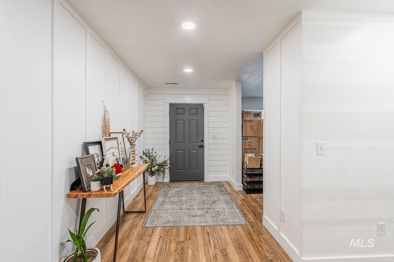 Entrance foyer featuring wood finished floors and recessed lighting