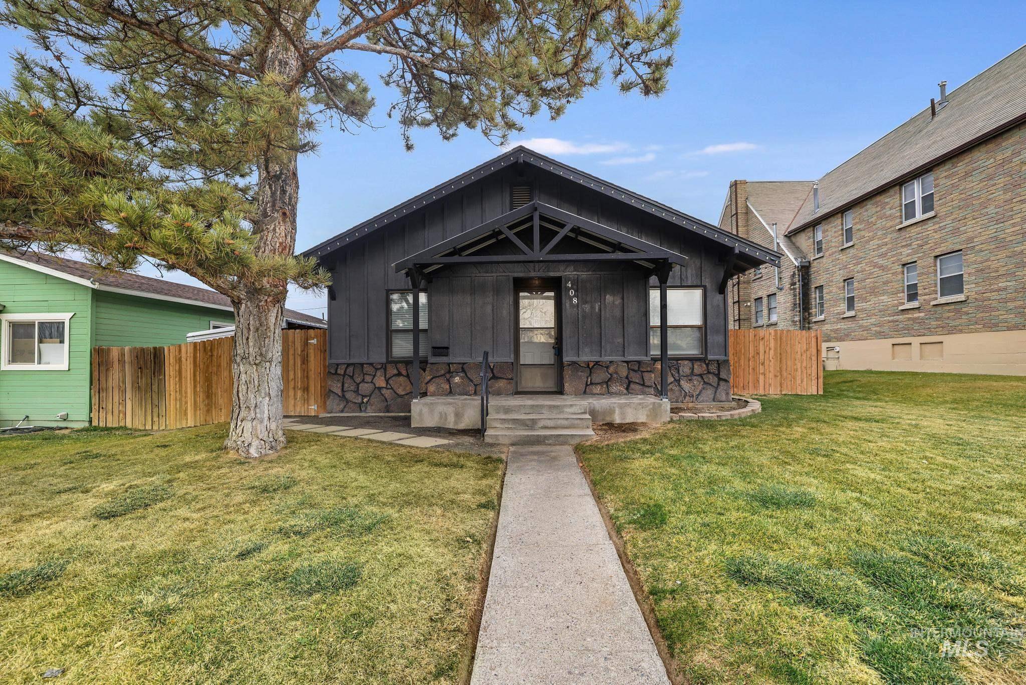 View of front of property featuring board and batten siding and a porch