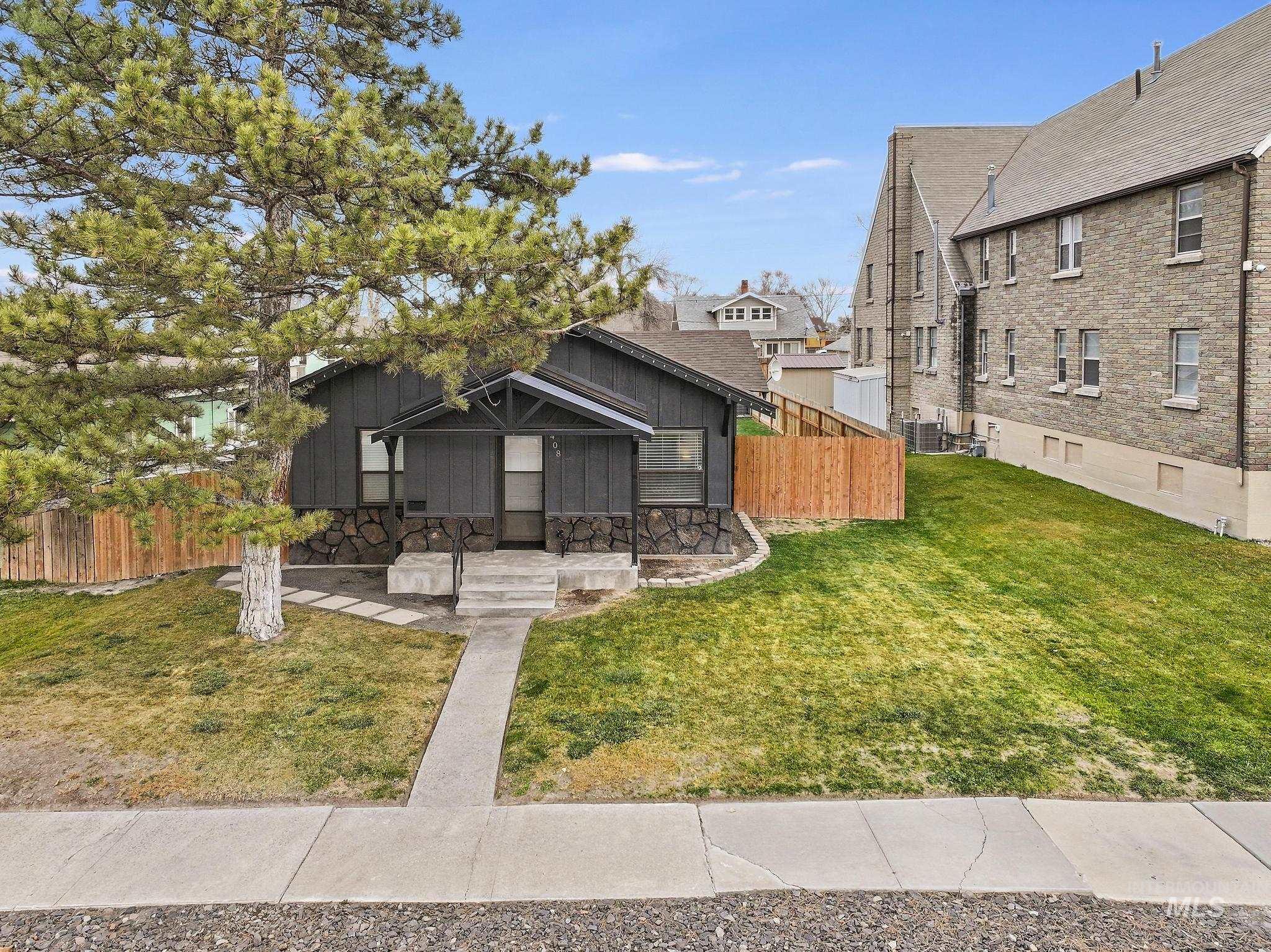 View of front of home with board and batten siding and a residential view