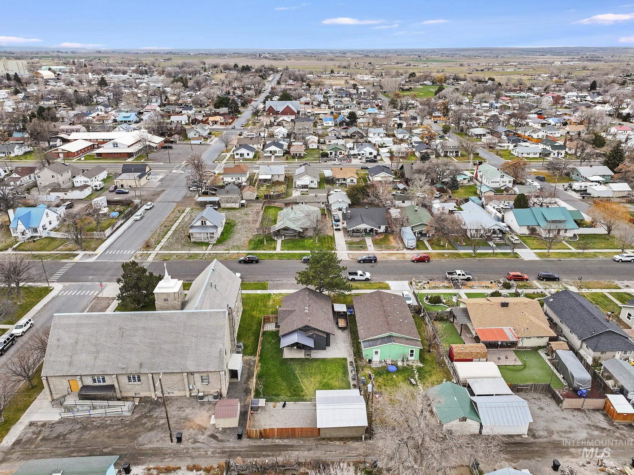 Aerial overview of property's location featuring nearby suburban area