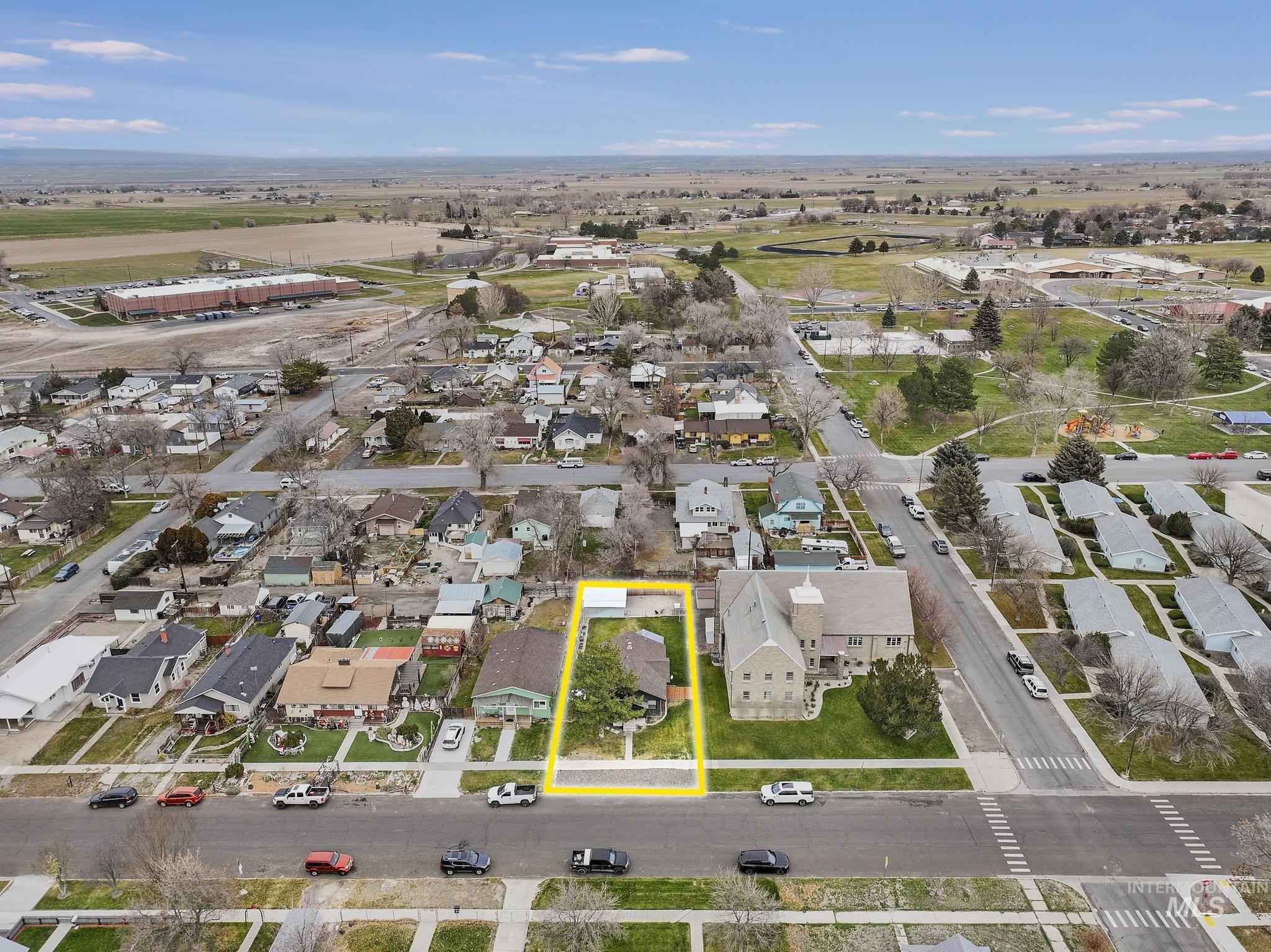 Aerial perspective of suburban area featuring property parcel outlined