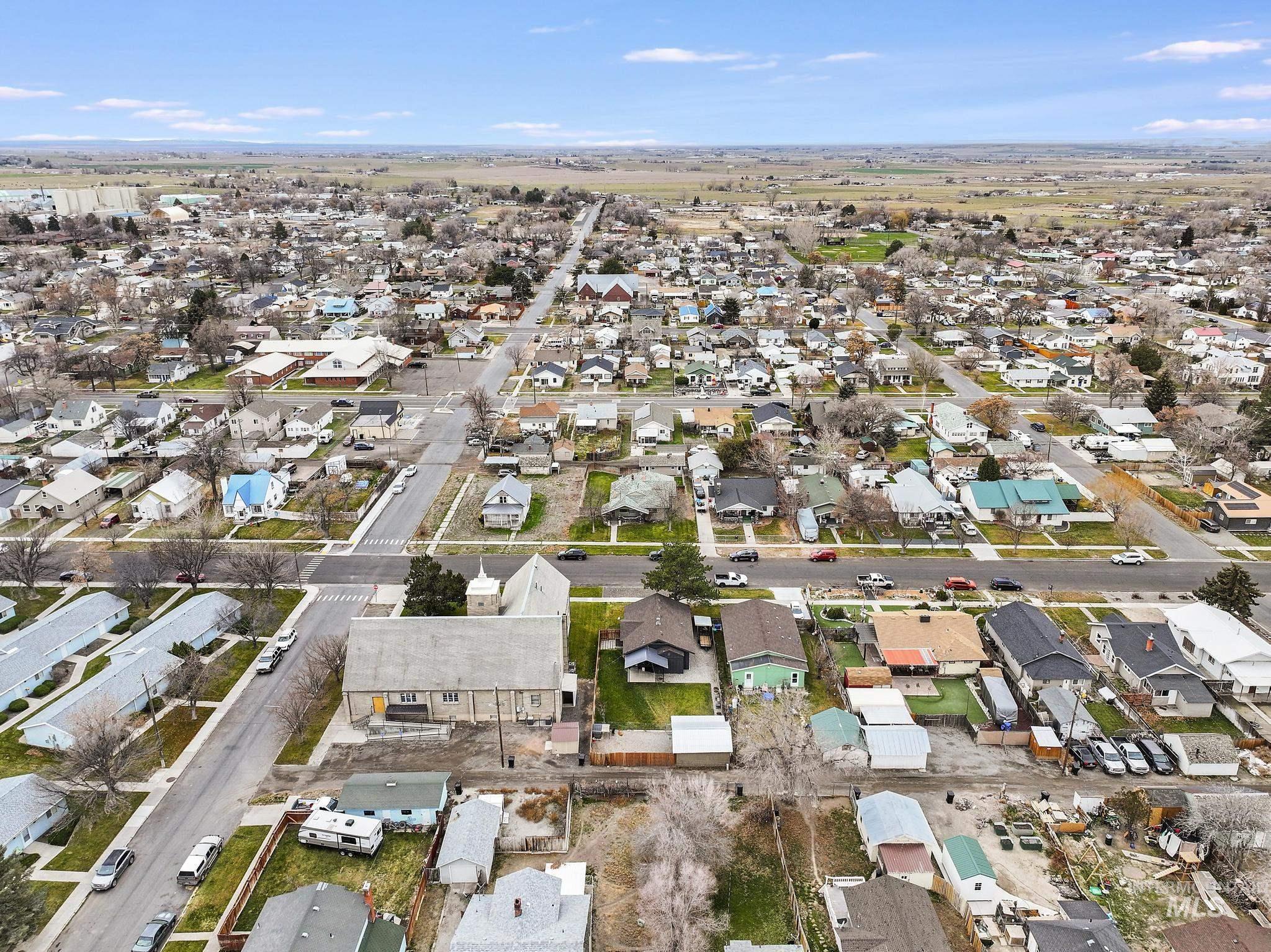 Aerial overview of property's location featuring nearby suburban area