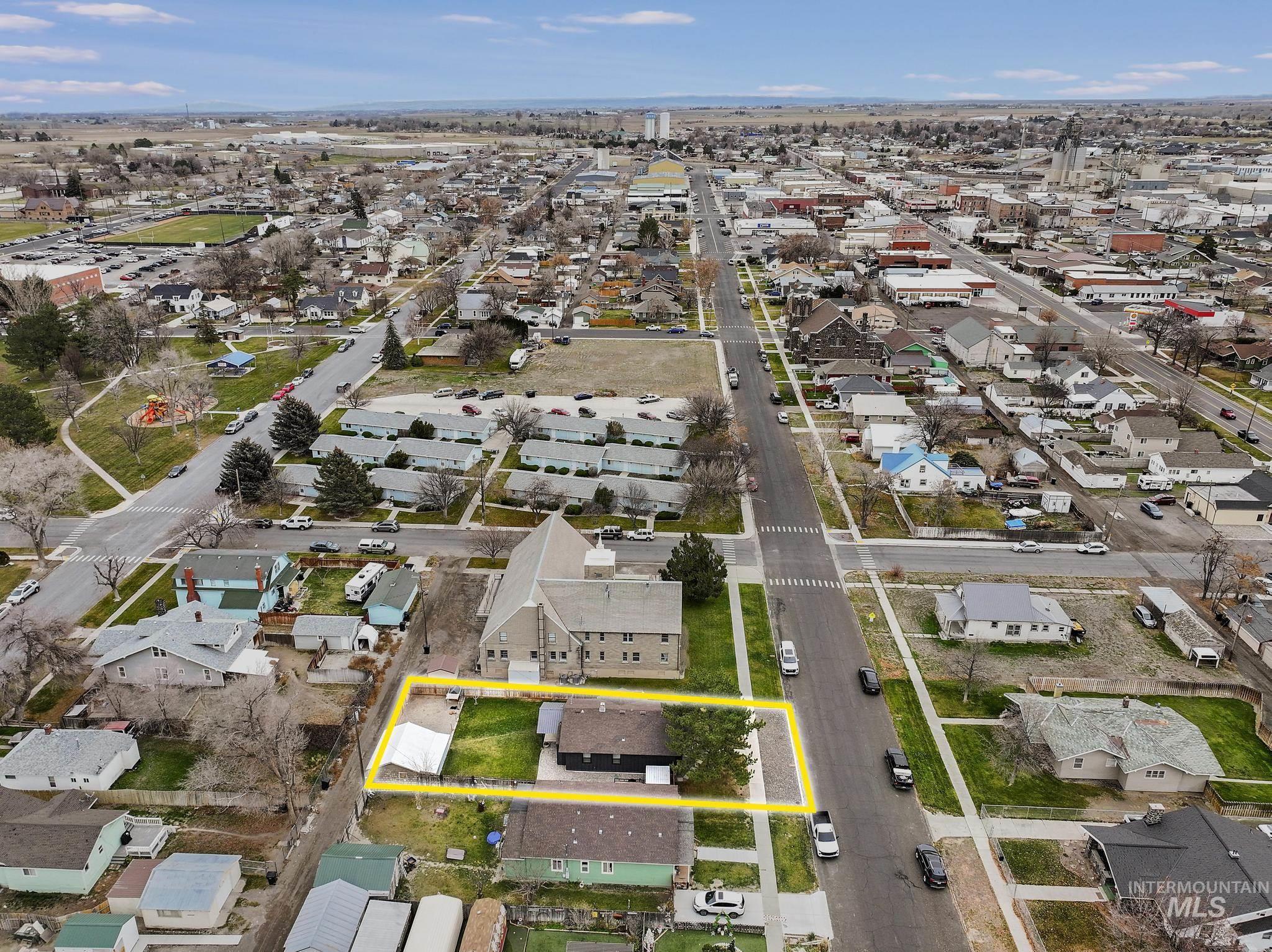 Aerial perspective of suburban area with property boundaries highlighted