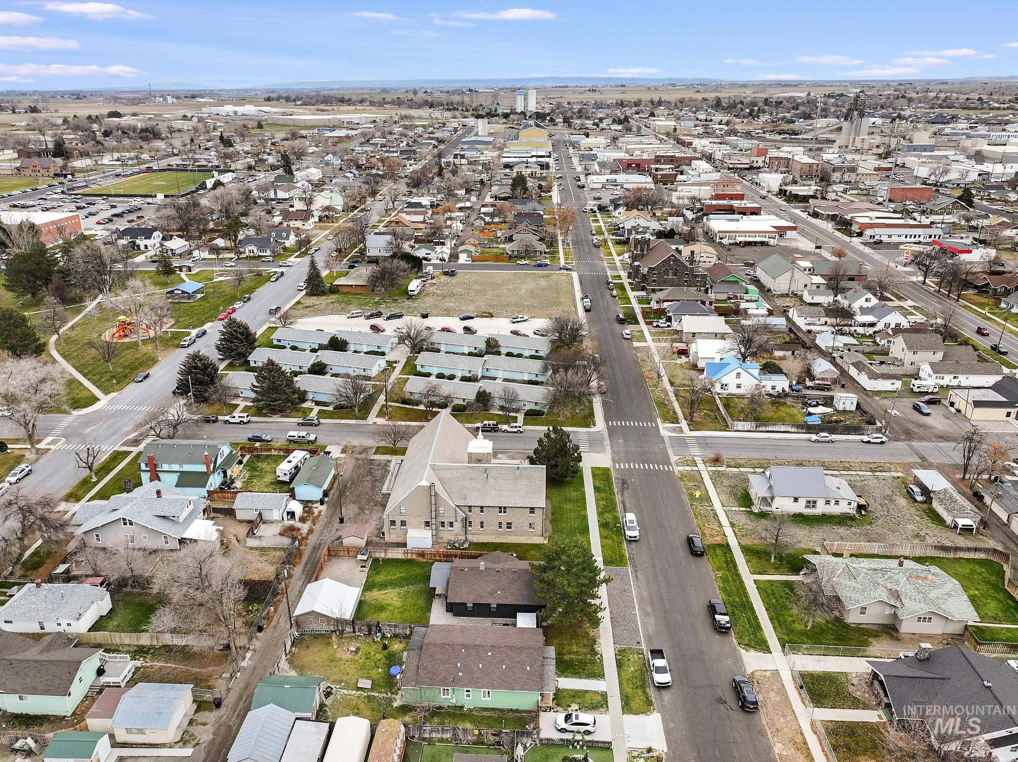 Aerial overview of property's location featuring nearby suburban area
