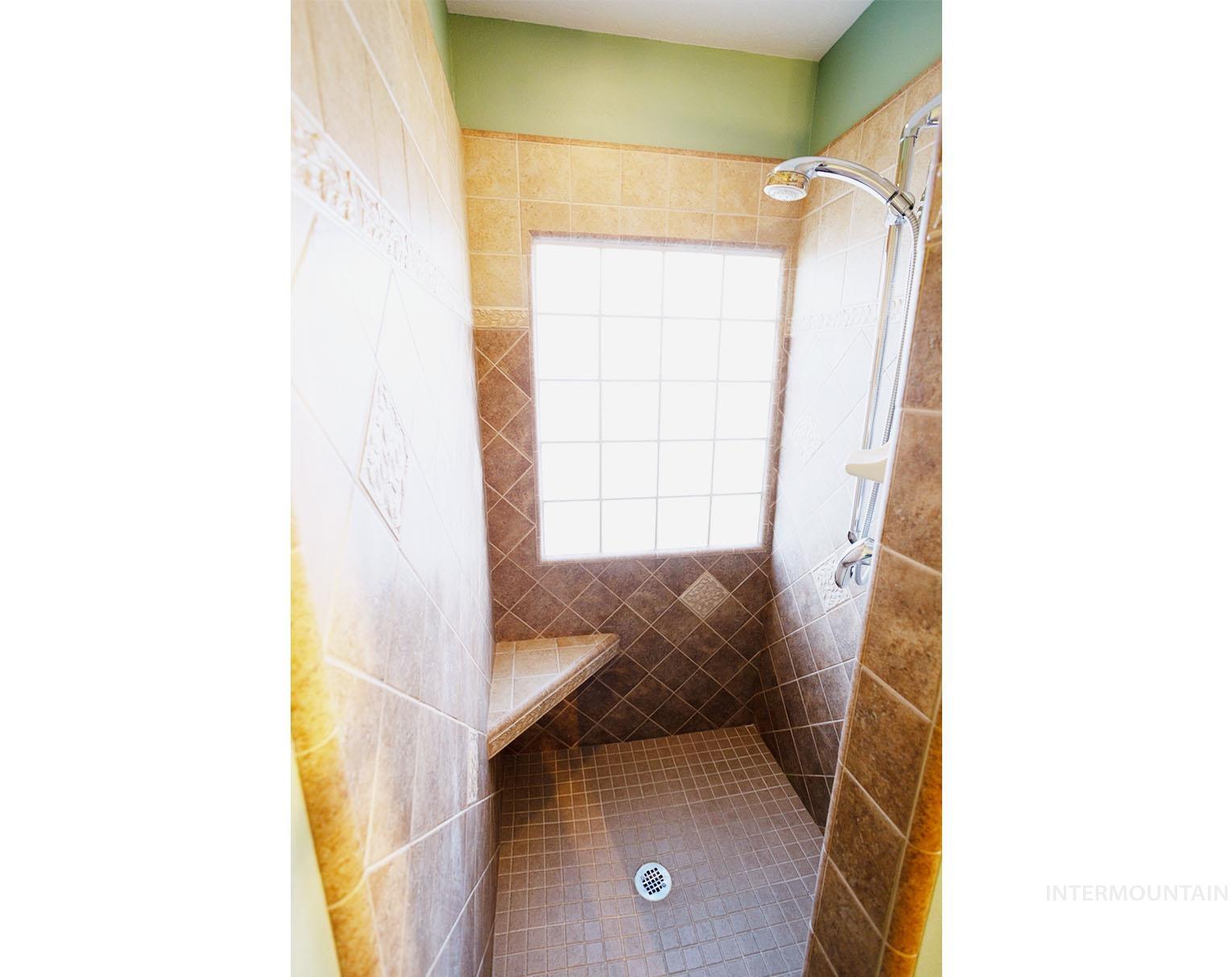 Bathroom featuring a tile shower