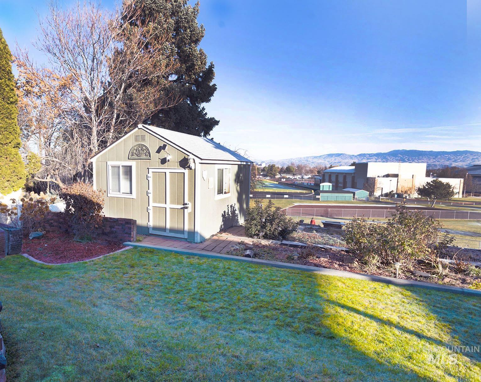 View of outbuilding with a mountain view