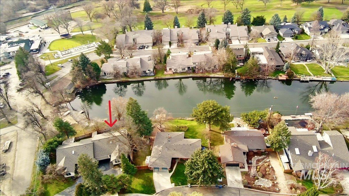 View of property location with nearby suburban area and a large body of water