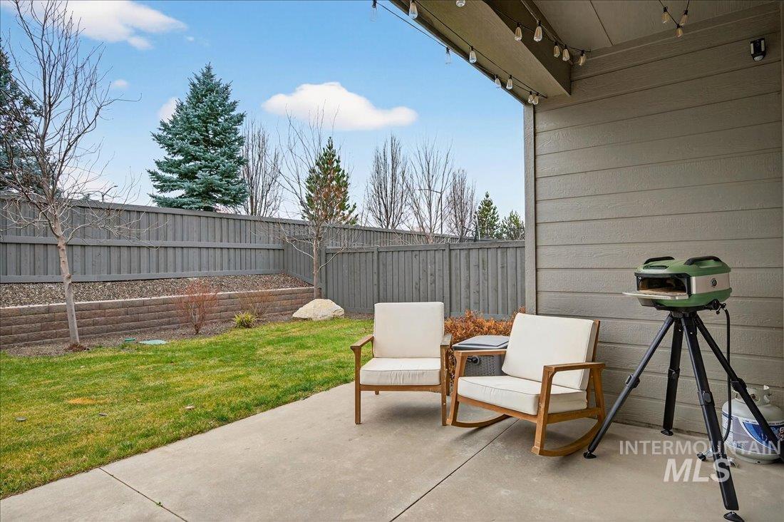 Fenced backyard featuring a patio