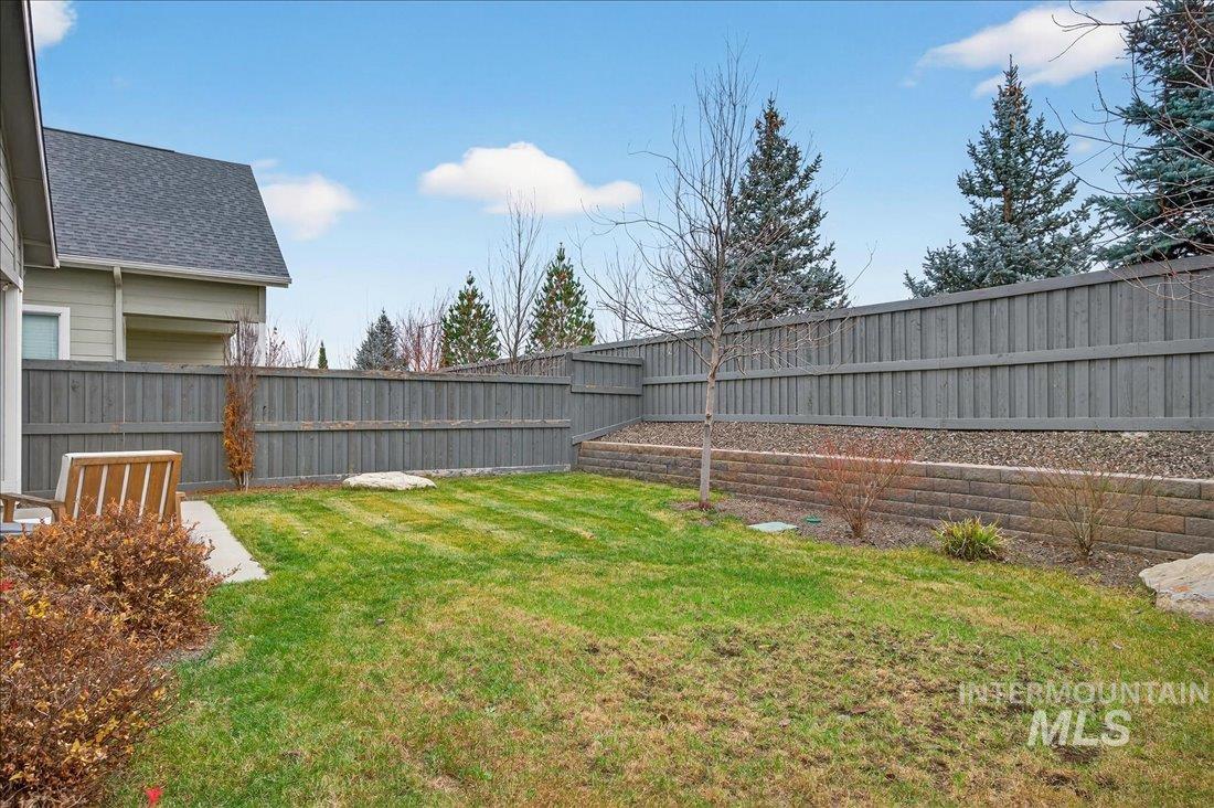 View of fenced backyard