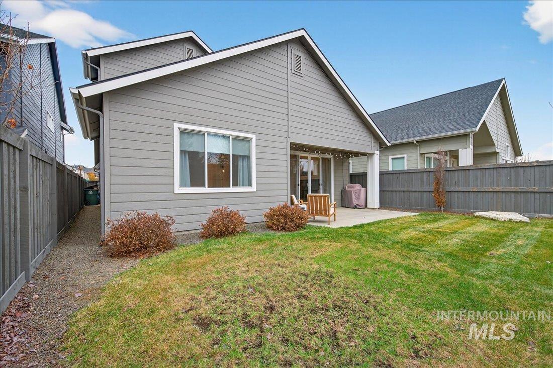 Back of property featuring a patio and a fenced backyard