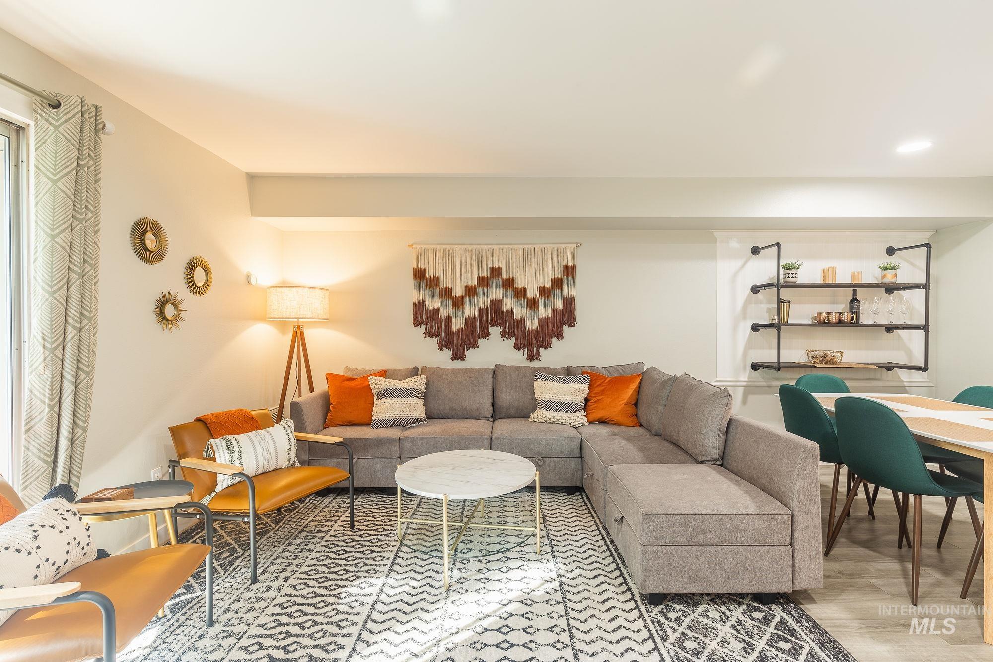 Living room with wood finished floors and recessed lighting