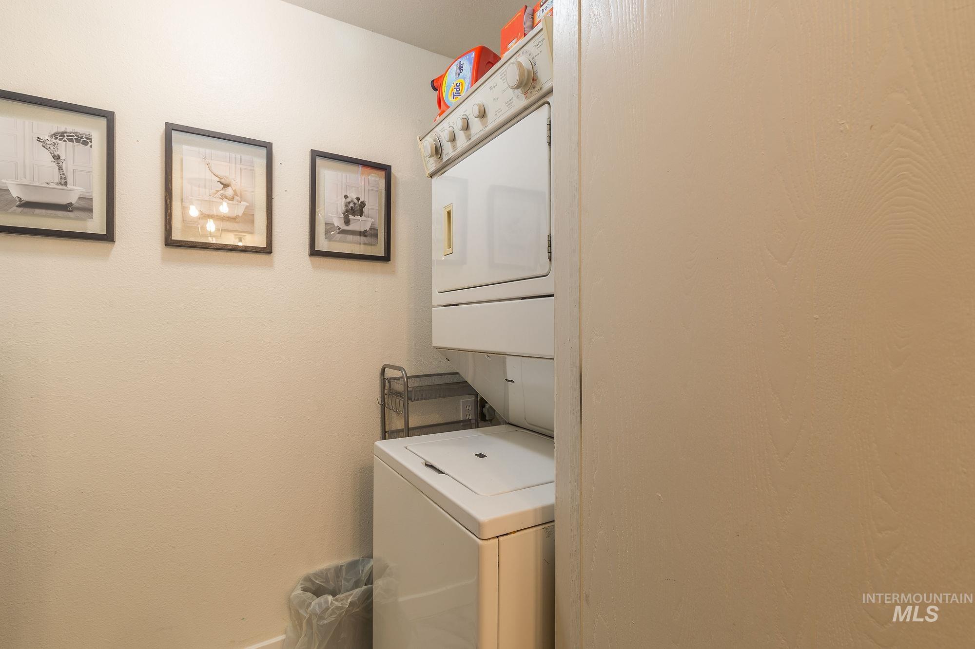 Laundry area with stacked washer / dryer