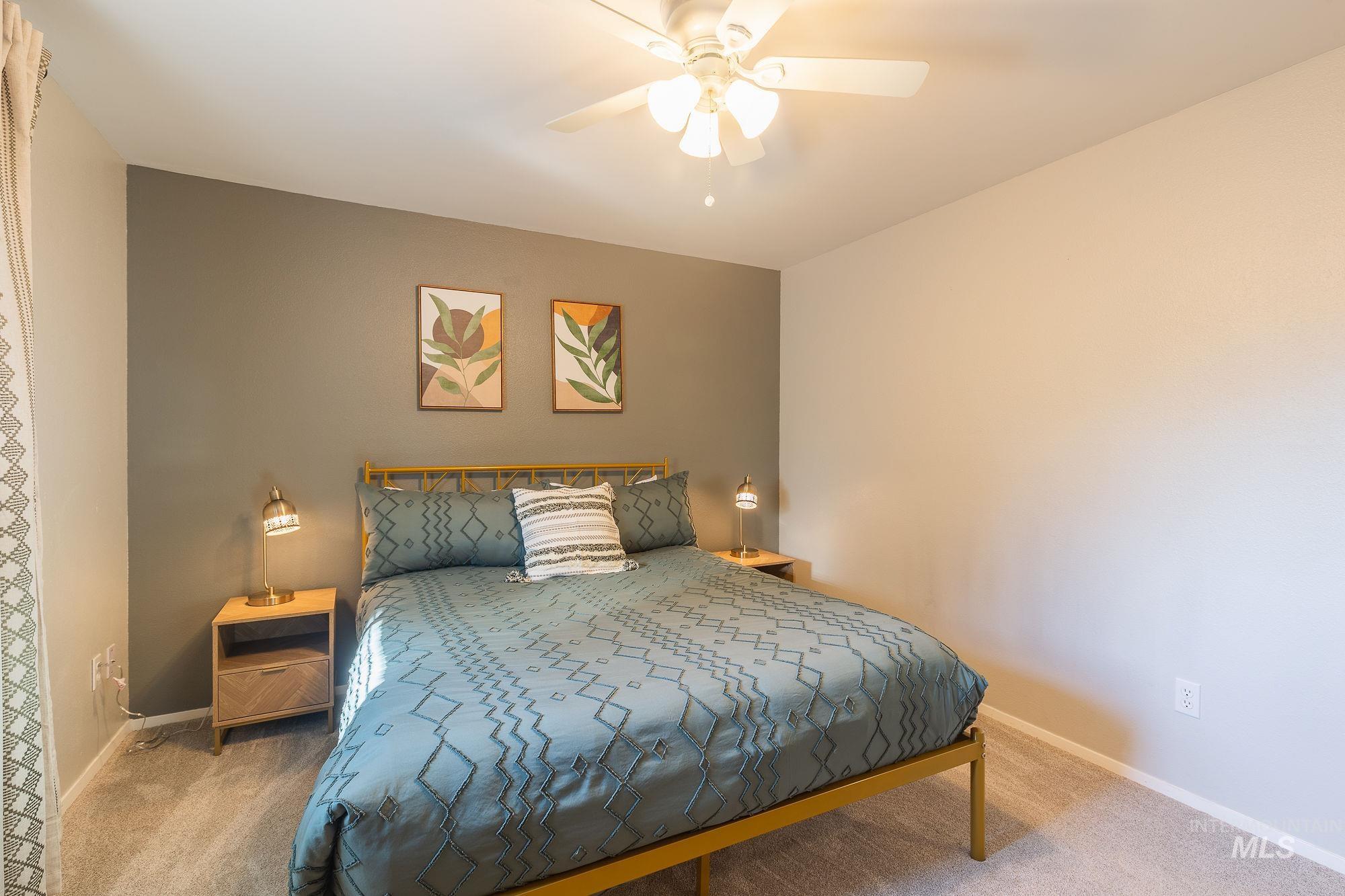 Bedroom featuring carpet floors and ceiling fan