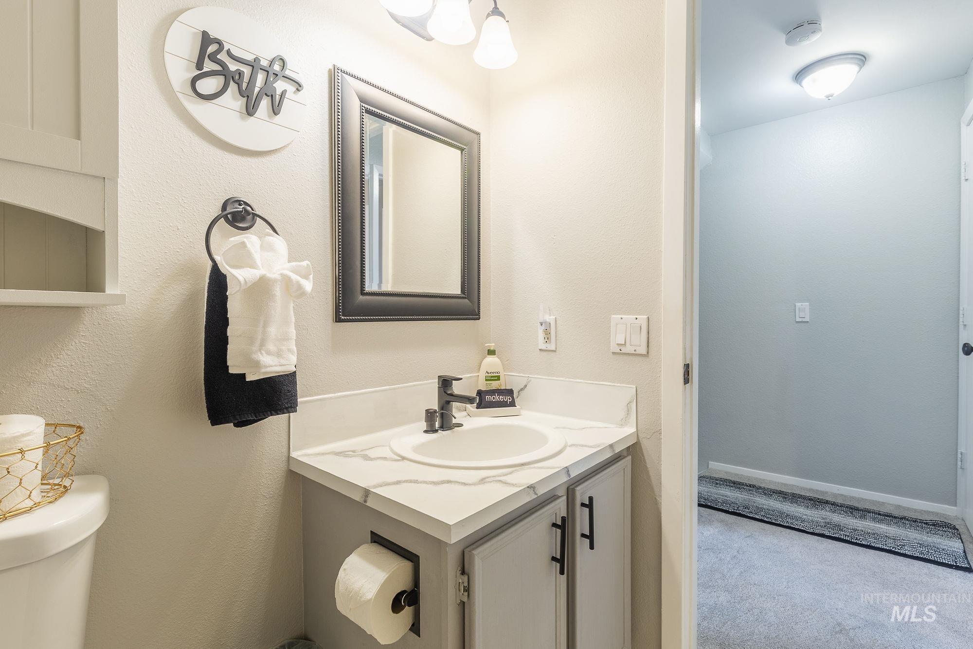 Bathroom featuring toilet and vanity
