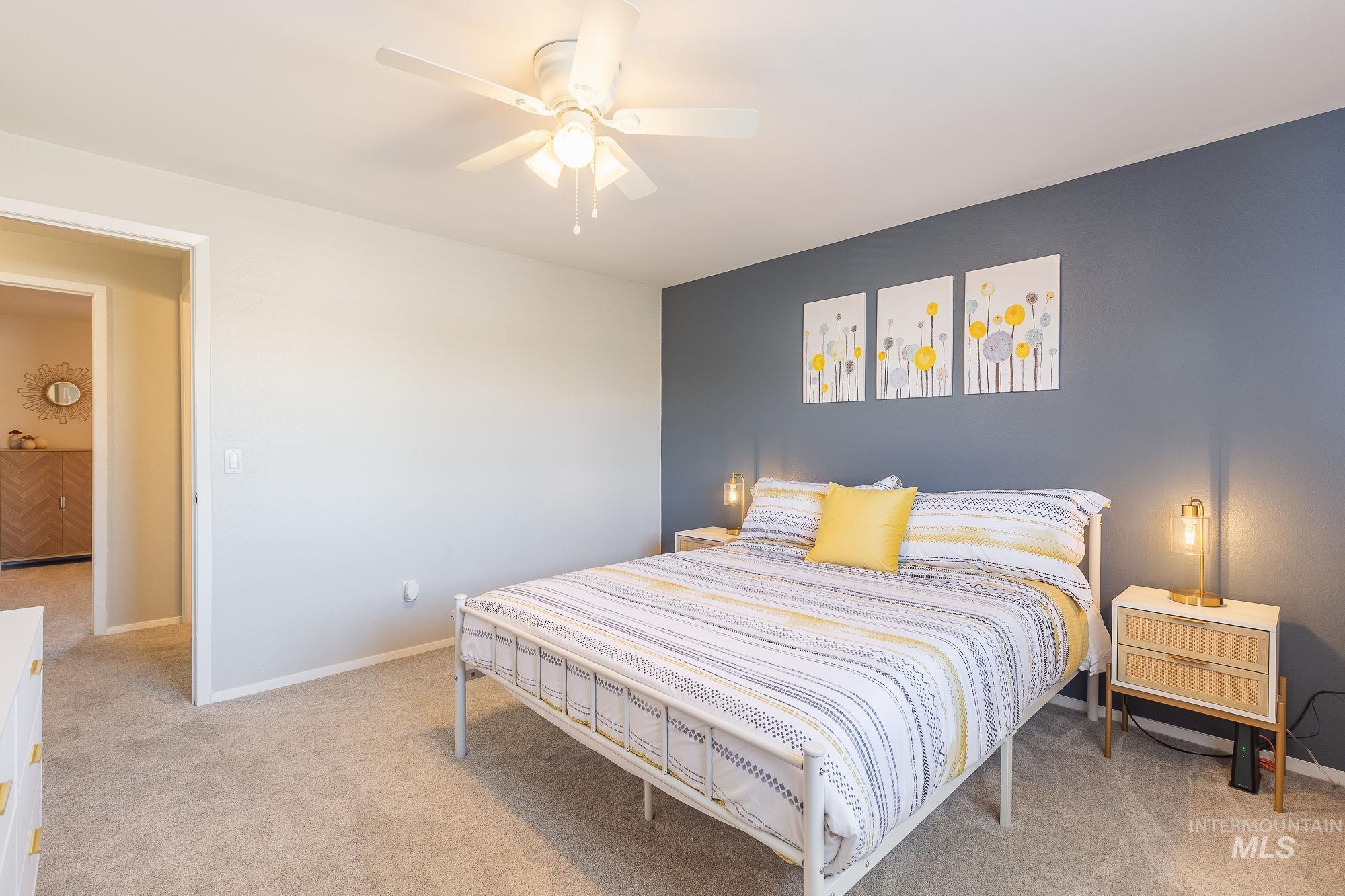 Bedroom with carpet floors and ceiling fan