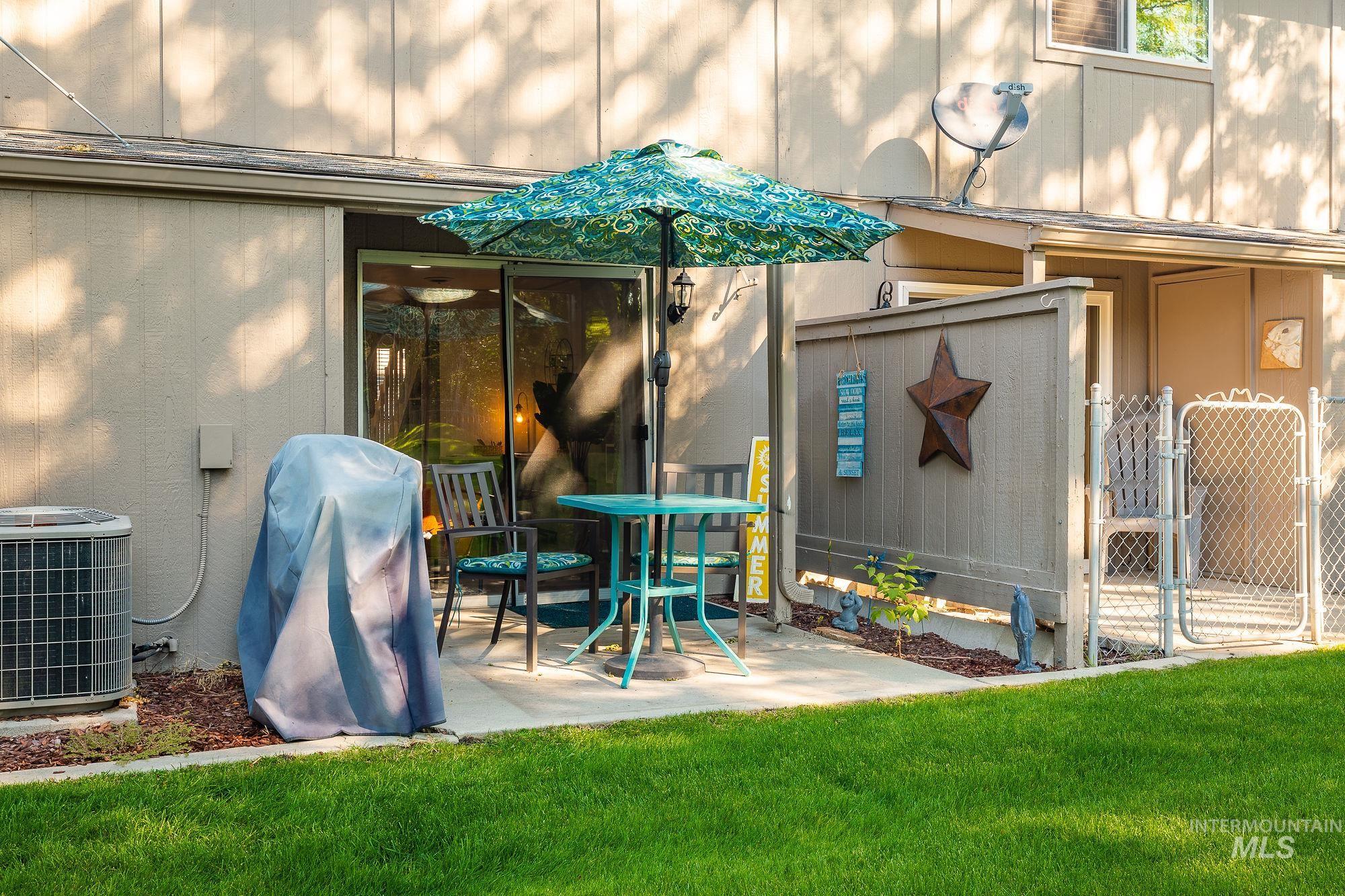 View of patio with a gate