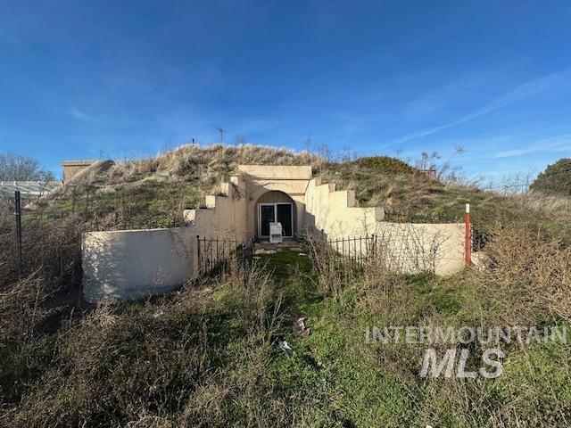 View of side of home with stucco siding