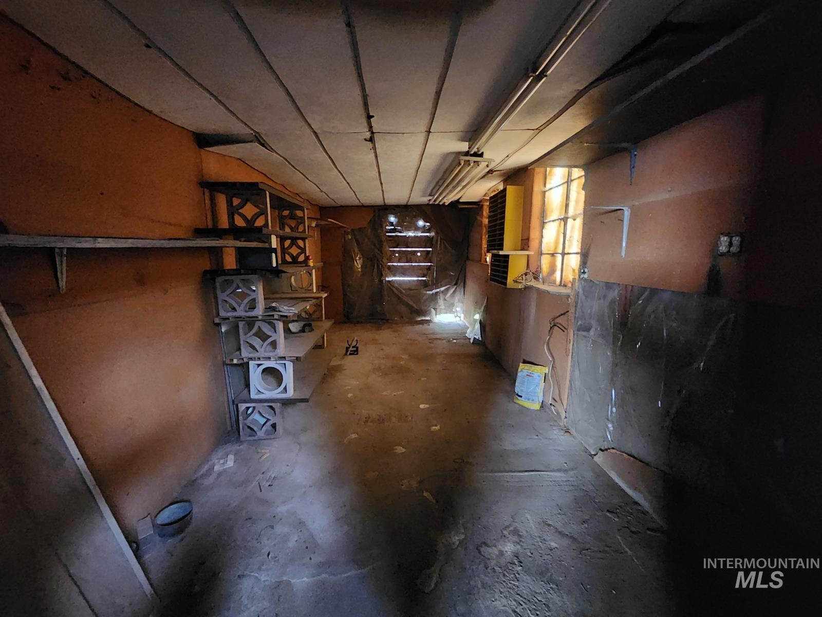 Corridor featuring concrete floors