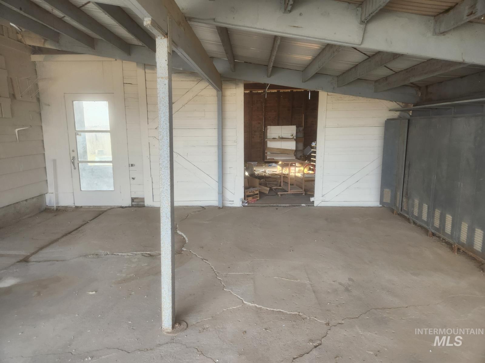 Below grade area featuring wood walls