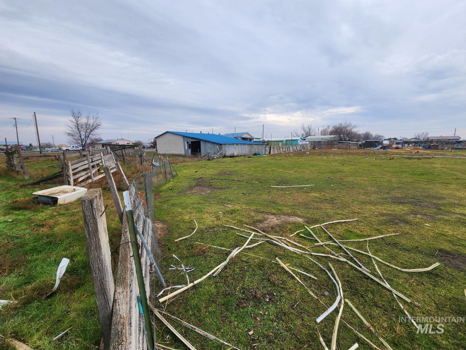 View of yard with an outbuilding and a rural view