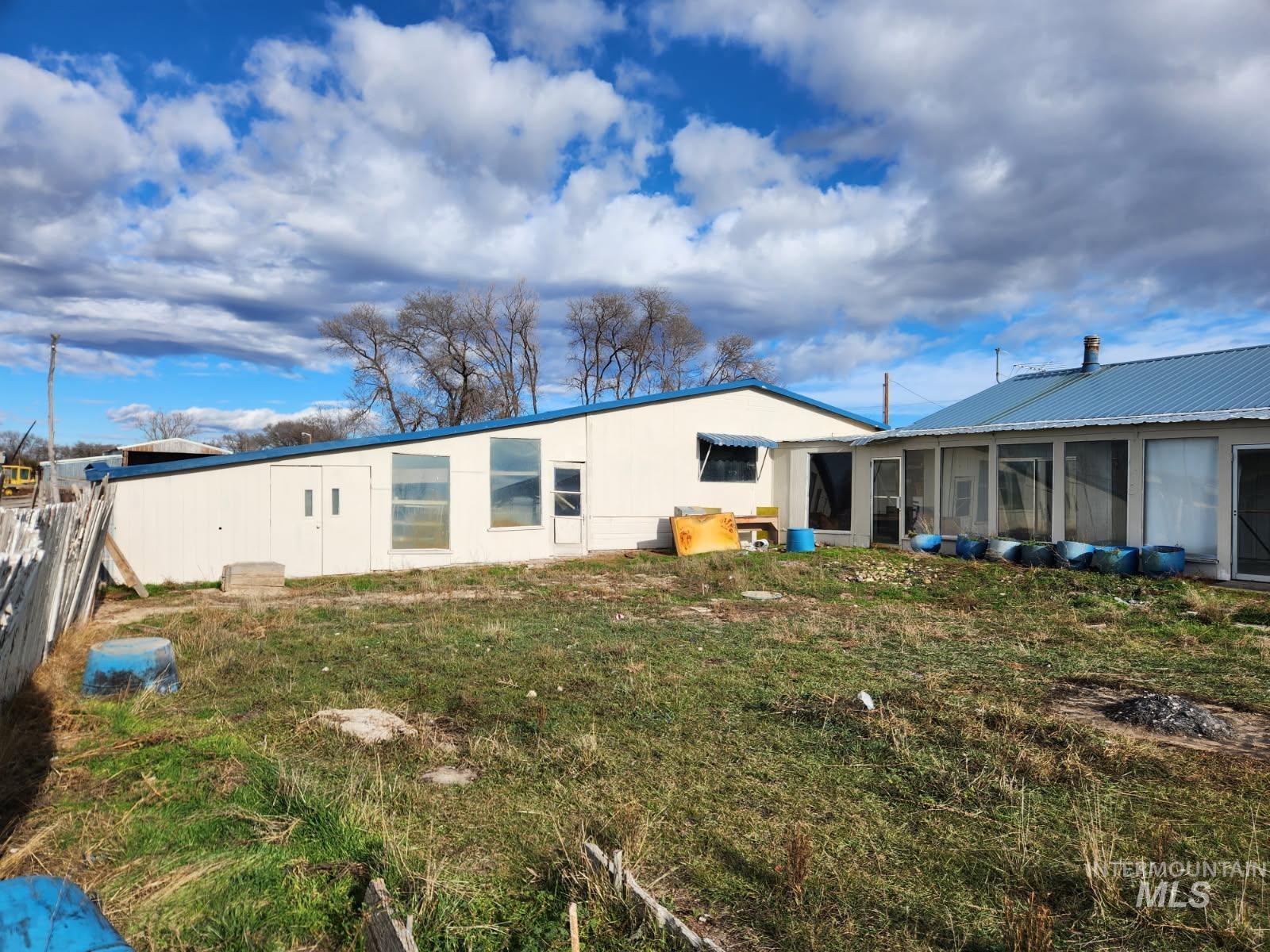 Back of house featuring a sunroom