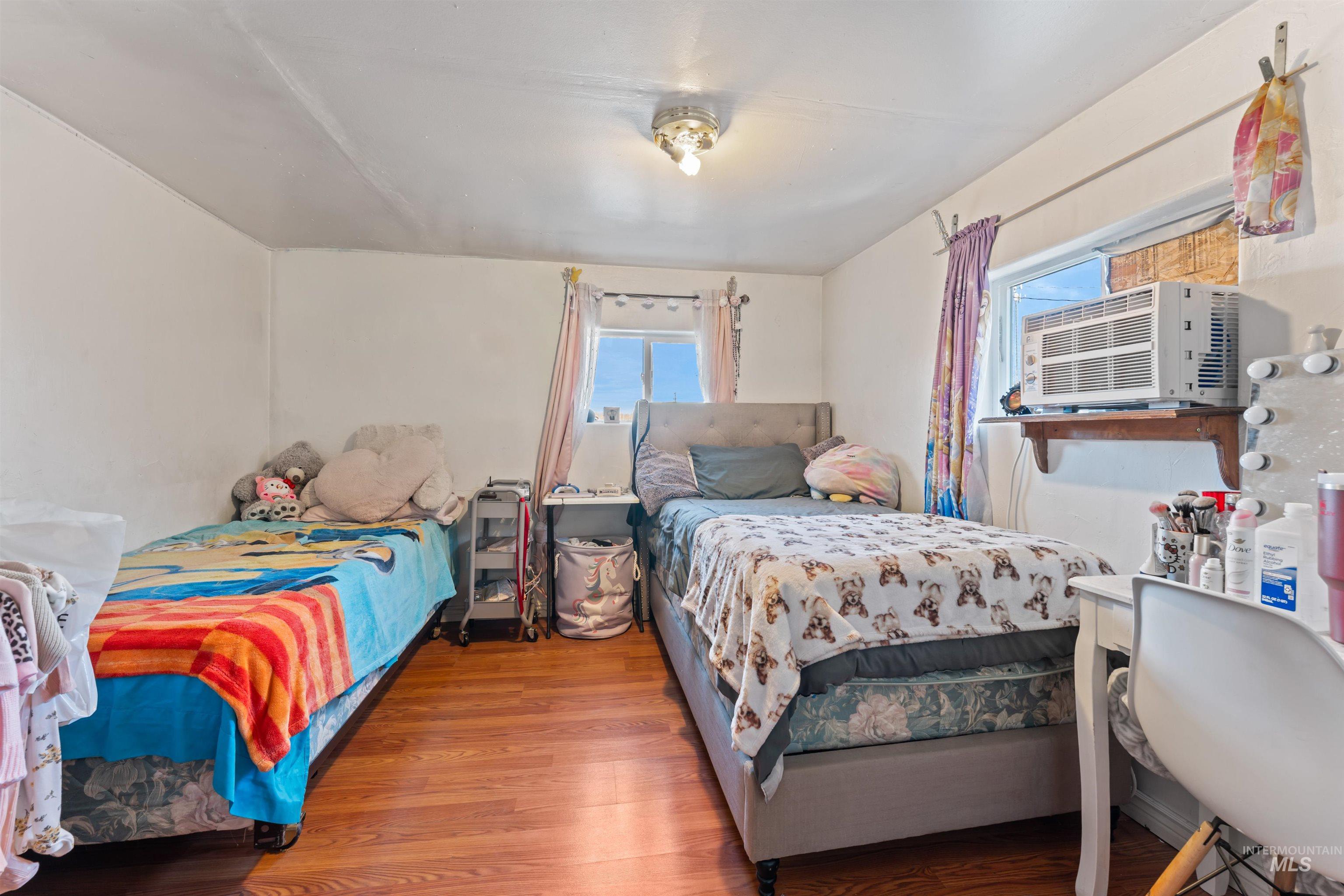 Bedroom featuring wood finished floors