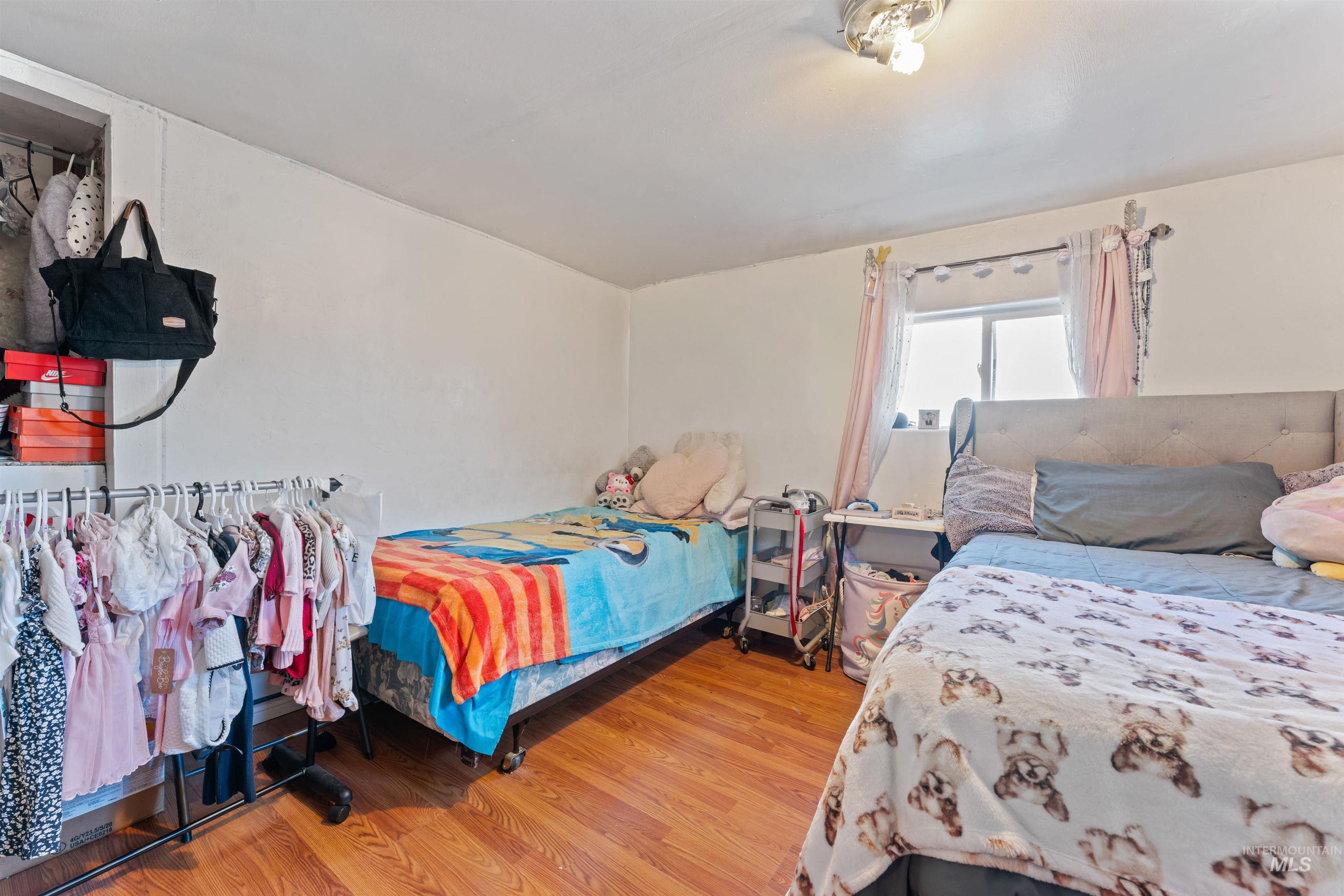 Bedroom with wood finished floors